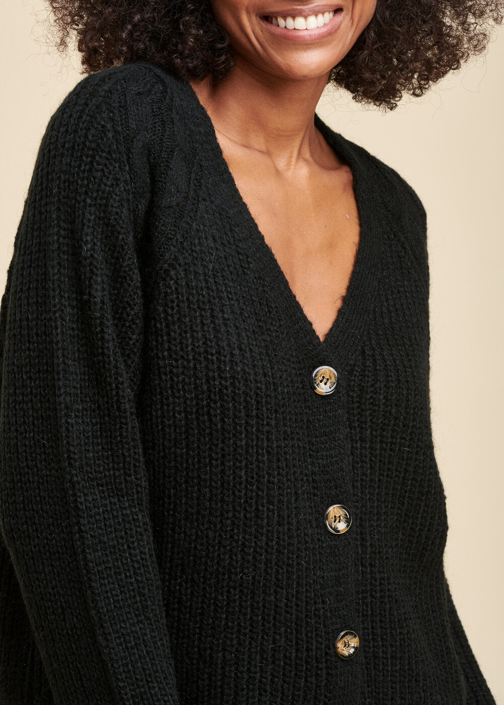 Cardigan scintillante con scollo a V