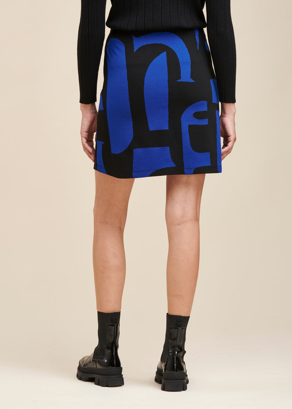 Gonna corta in jersey con motivo geometrico