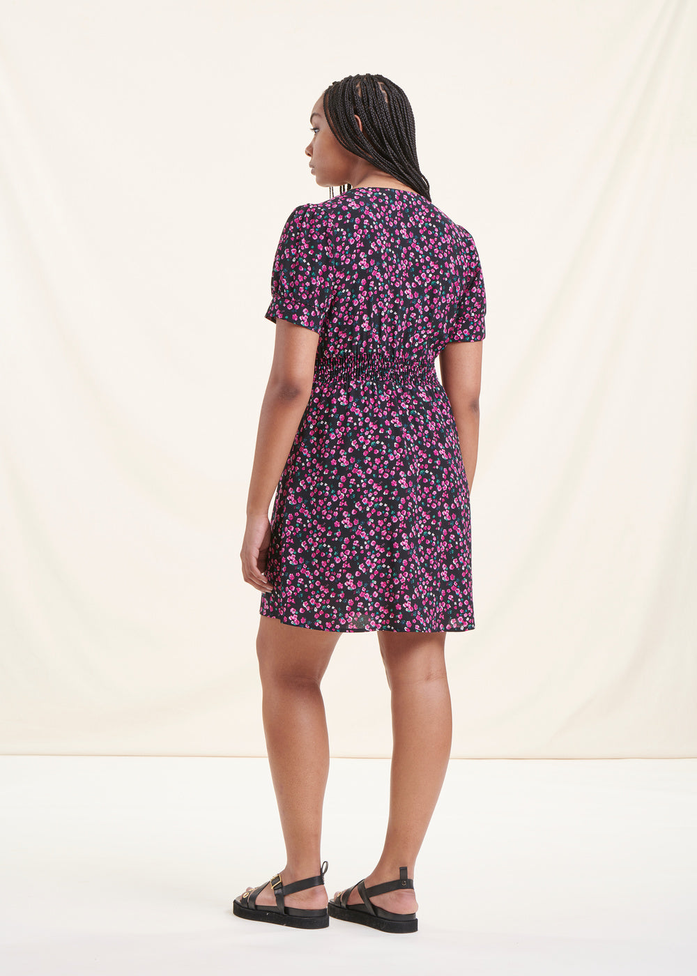 Short black fitted floral dress with short sleeves