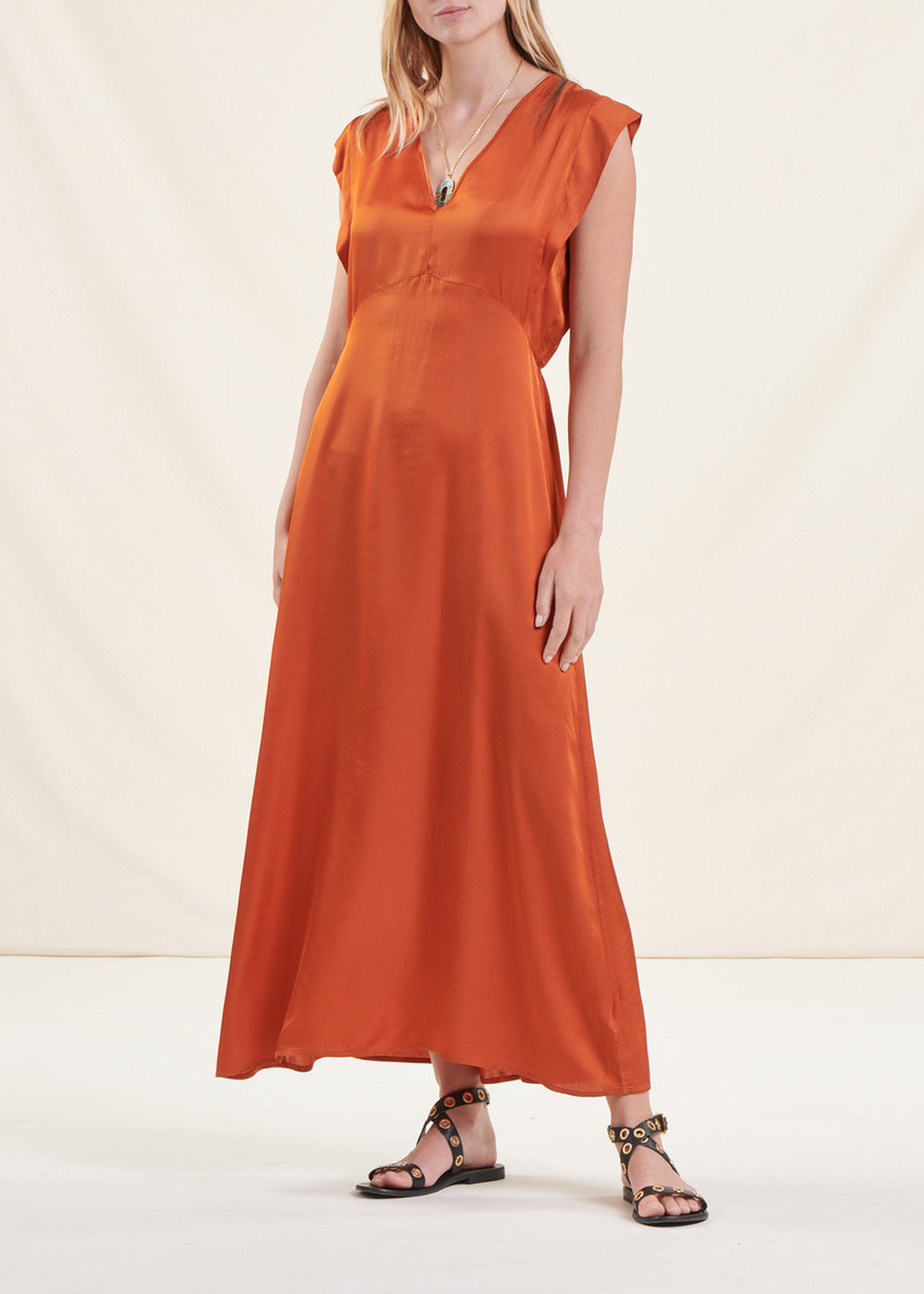 Long flowing cognac fitted satin dress