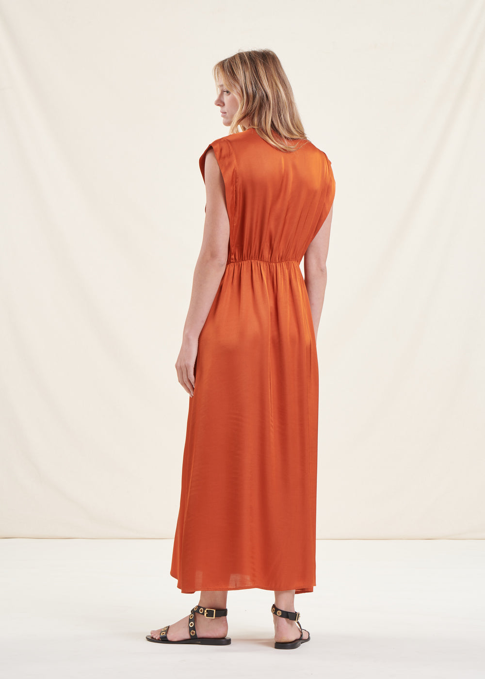 Long flowing cognac fitted satin dress