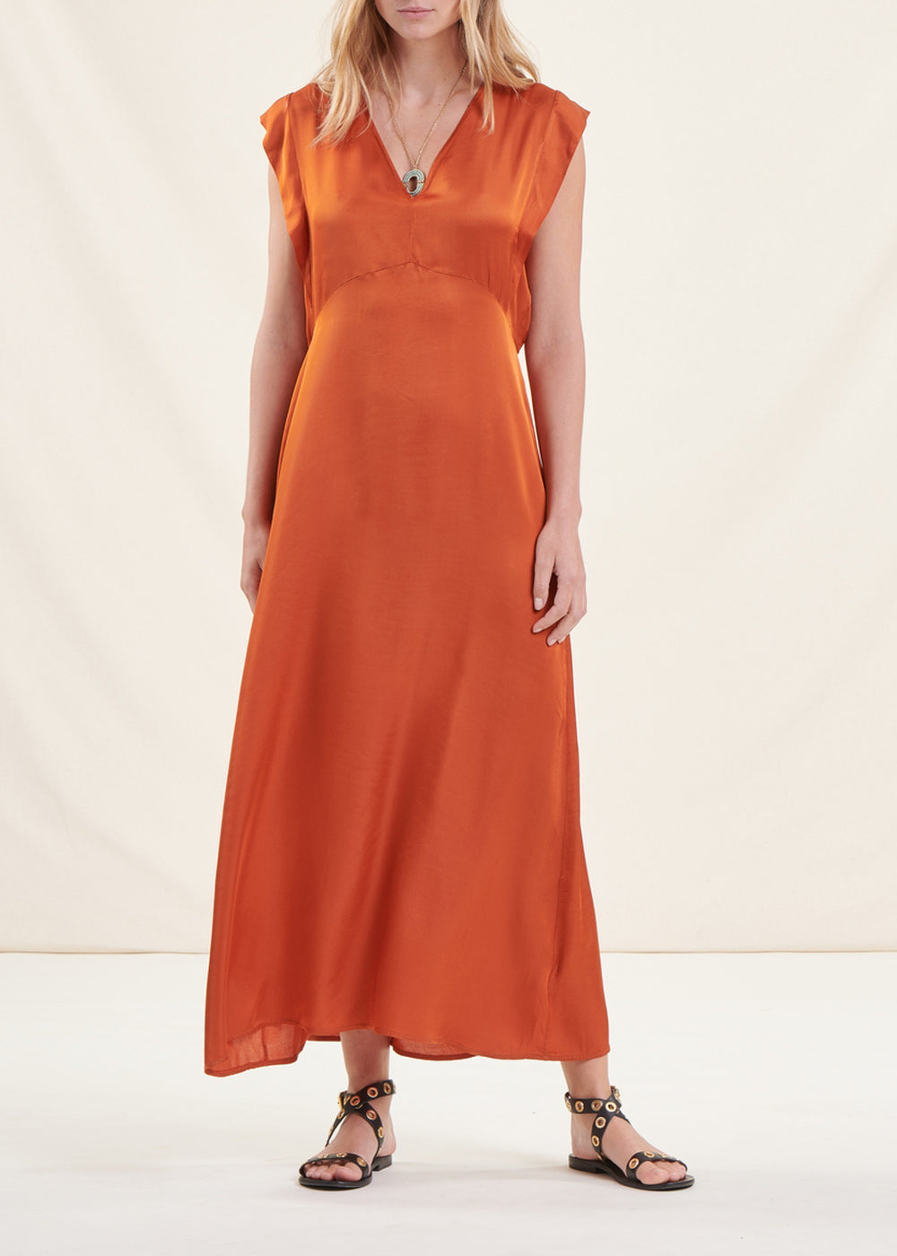 Long flowing cognac fitted satin dress