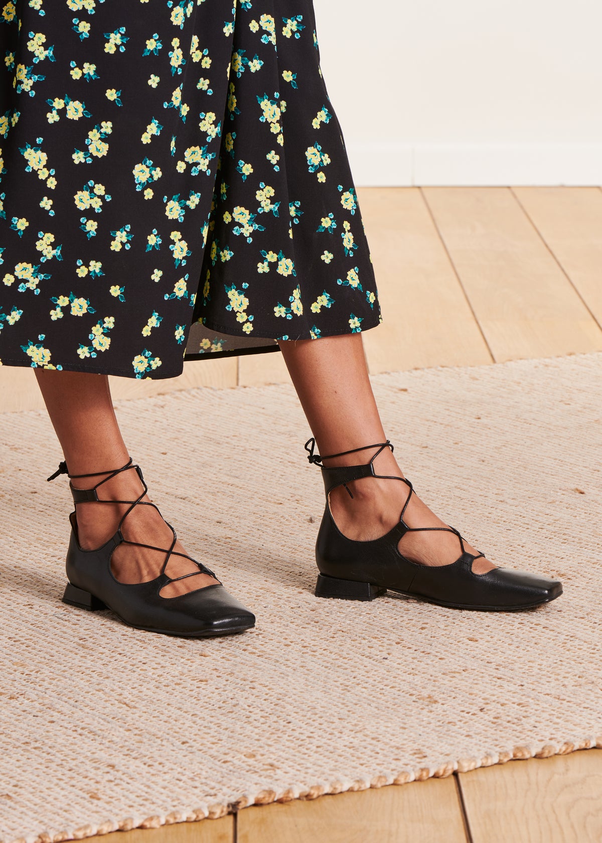 Black lace-up ballerinas