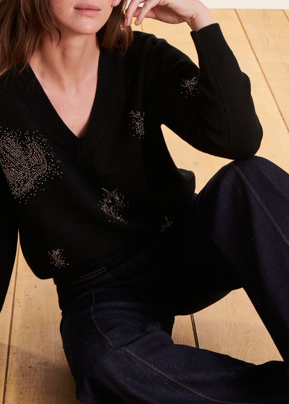 black sequined V-neck sweater