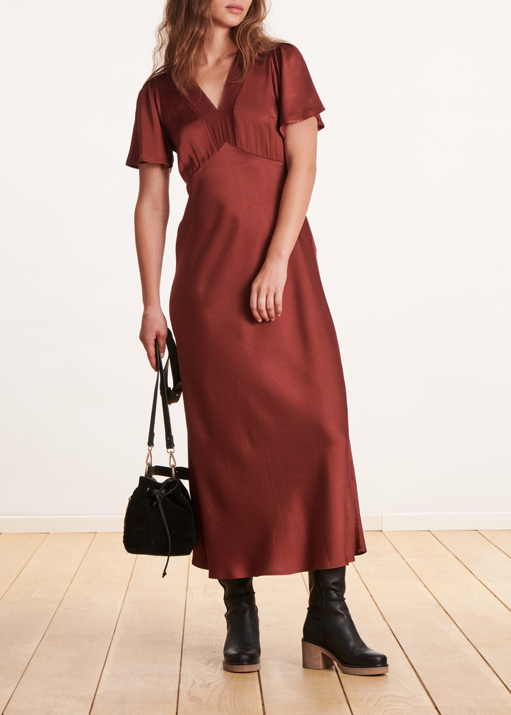 Long flowing burgundy fitted dress with short sleeves