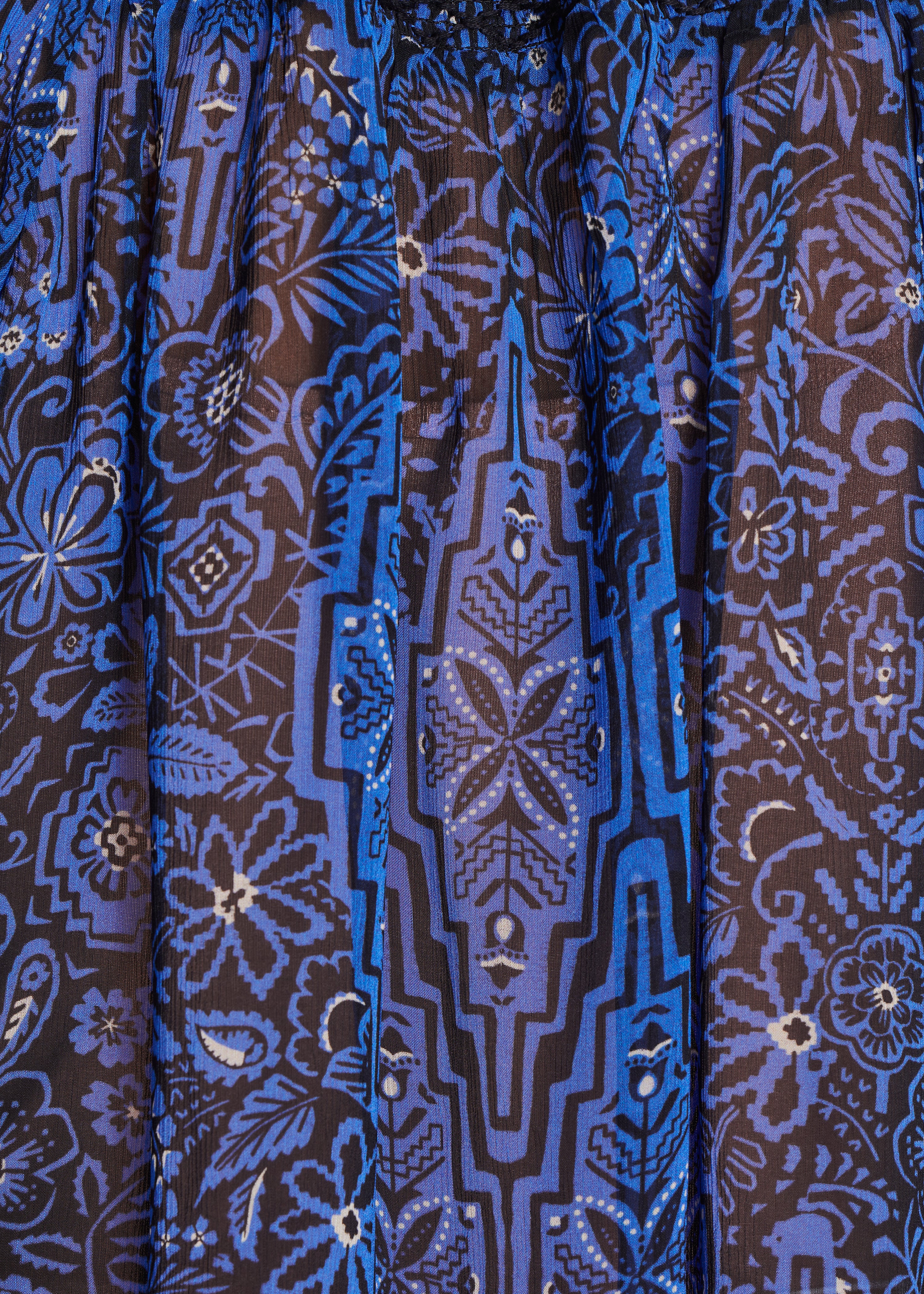 Top stampato blu royal, maniche lunghe, aderente.