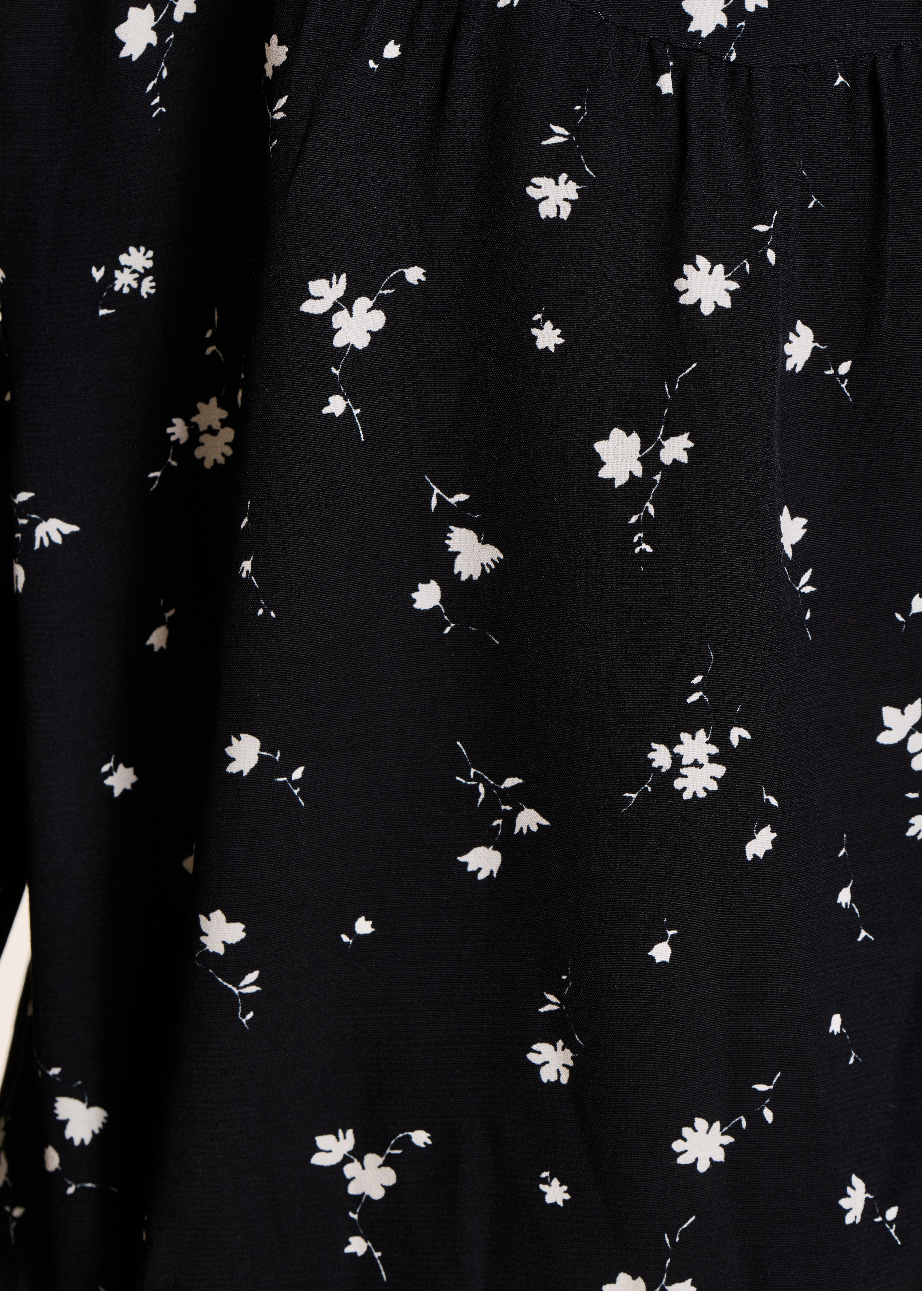 Loose black and white shirt with floral print