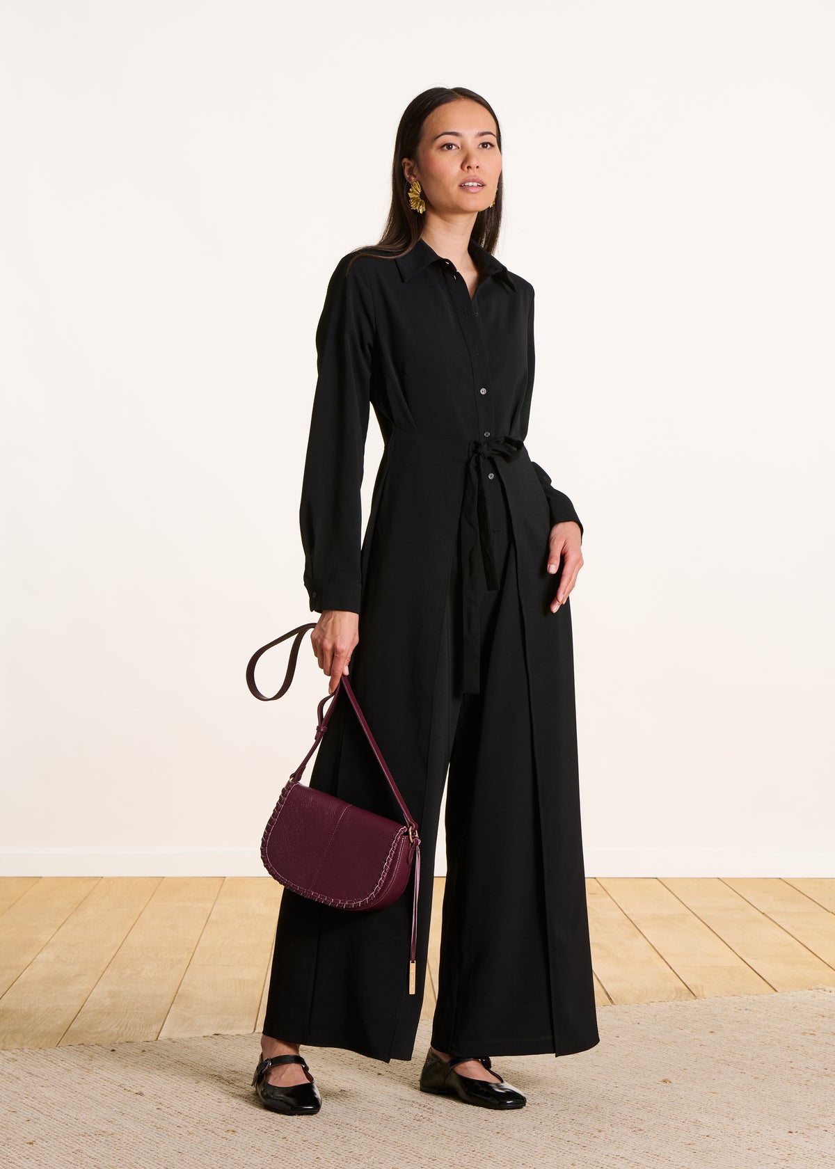 Black long-sleeved jumpsuit with shirt collar