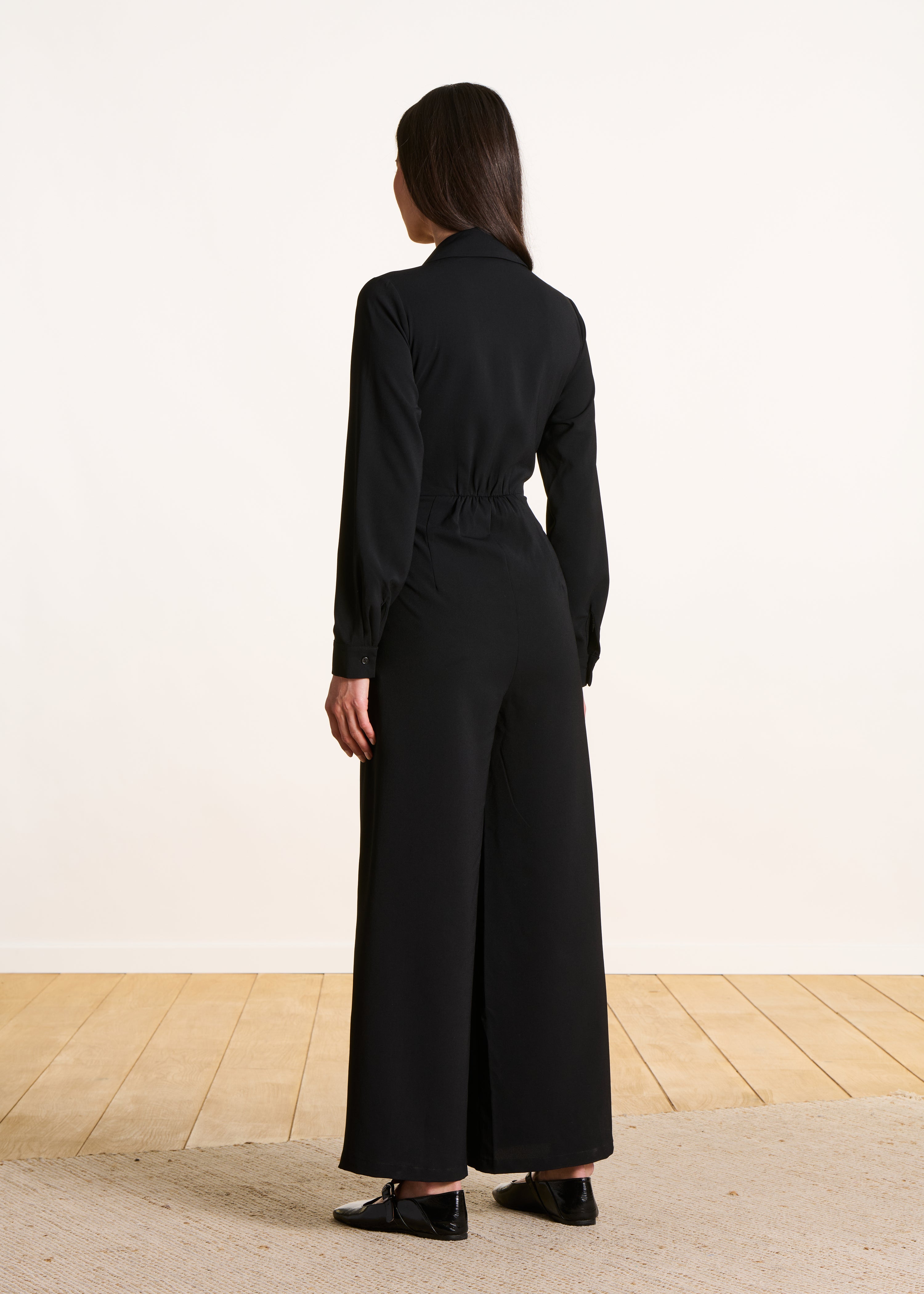 Black long-sleeved jumpsuit with shirt collar