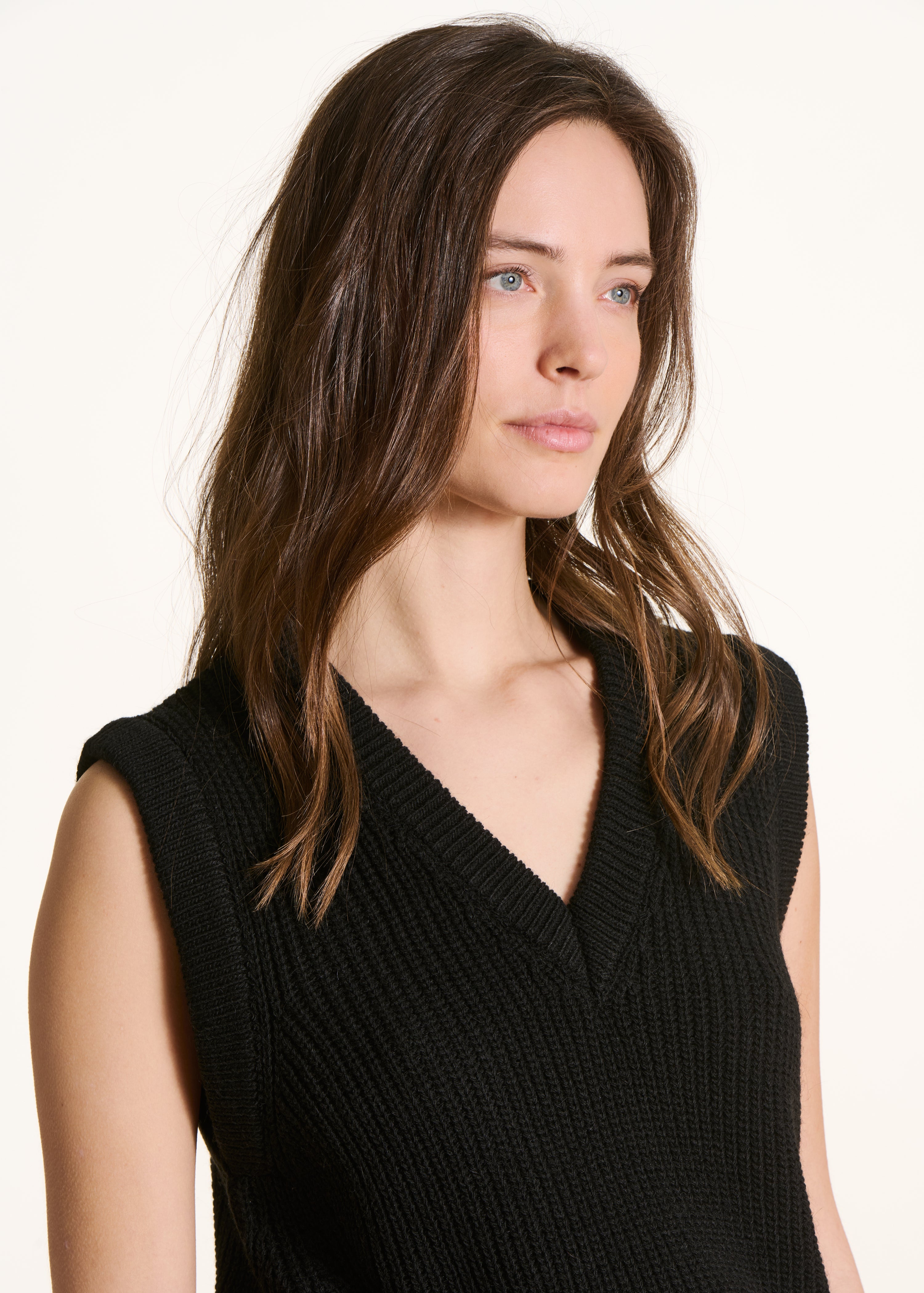 black sleeveless V-neck jumper