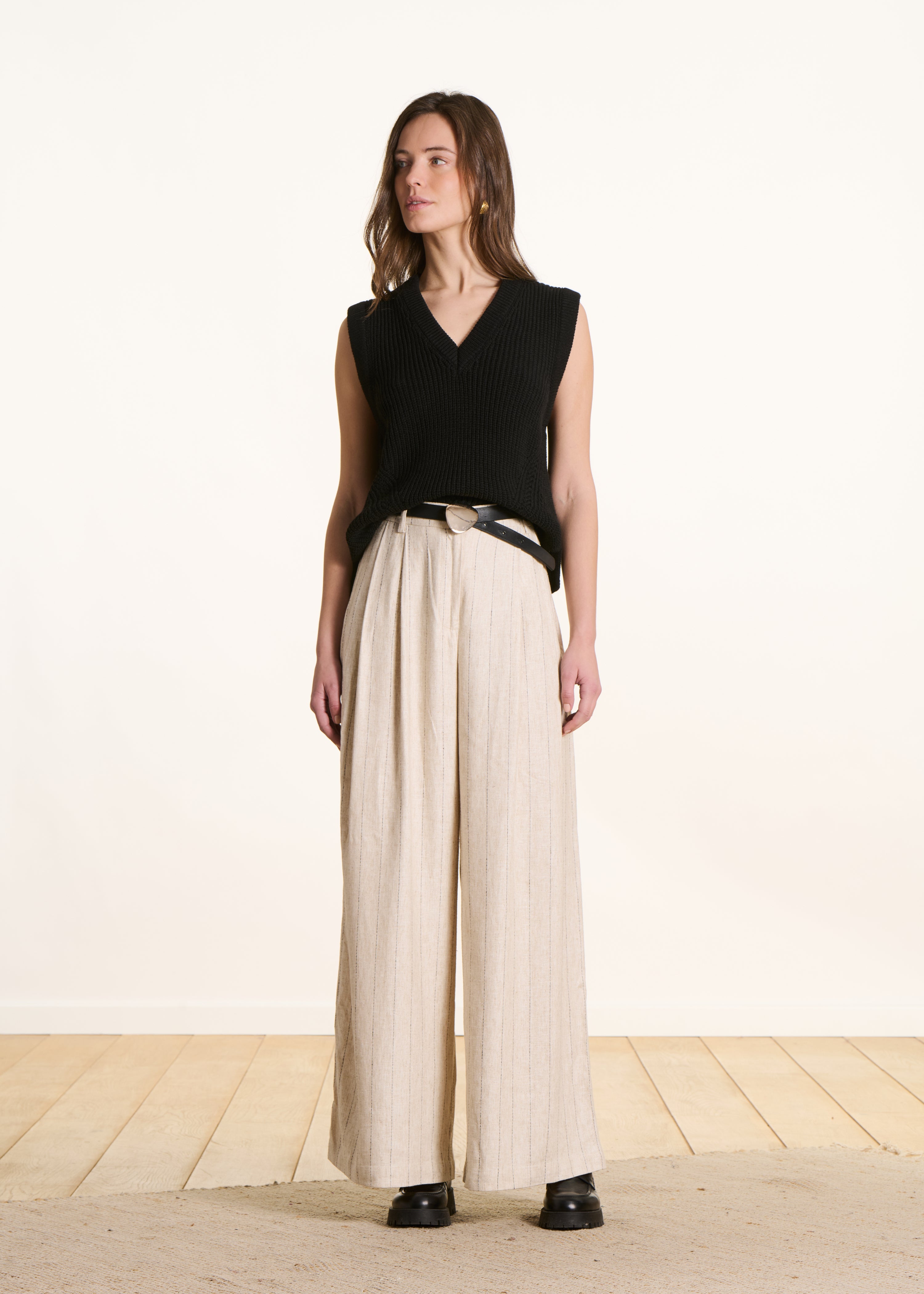 black sleeveless V-neck jumper