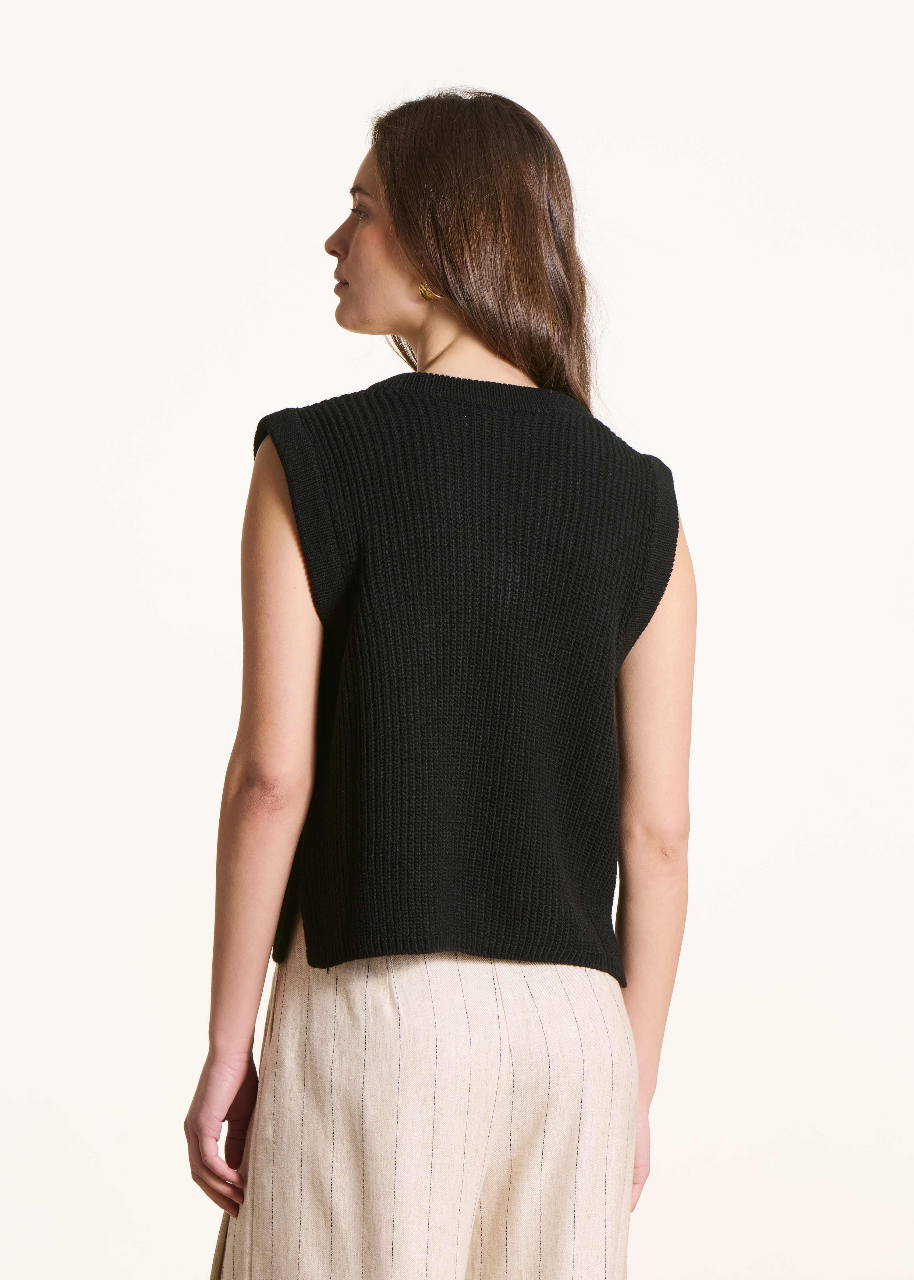 black sleeveless V-neck jumper