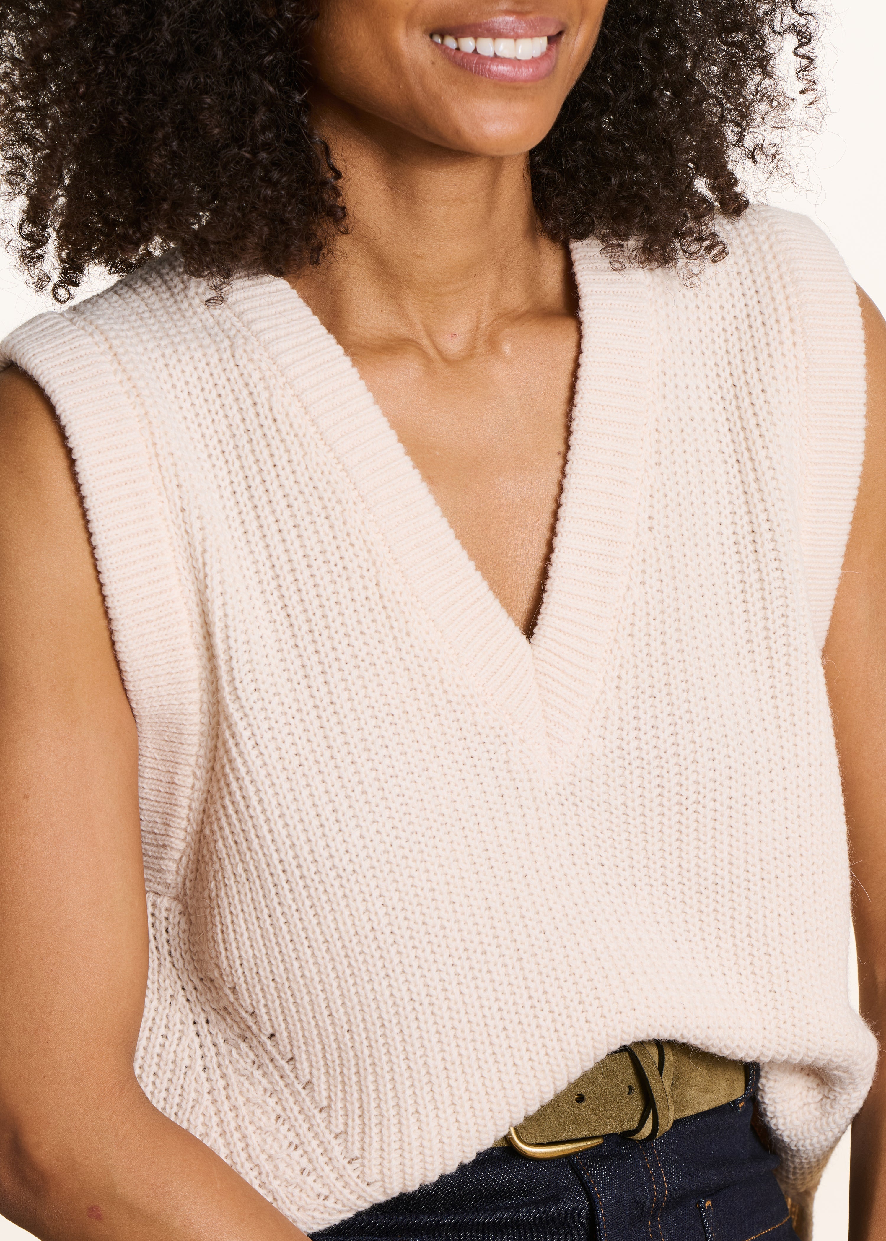 Off-white sleeveless V-neck jumper