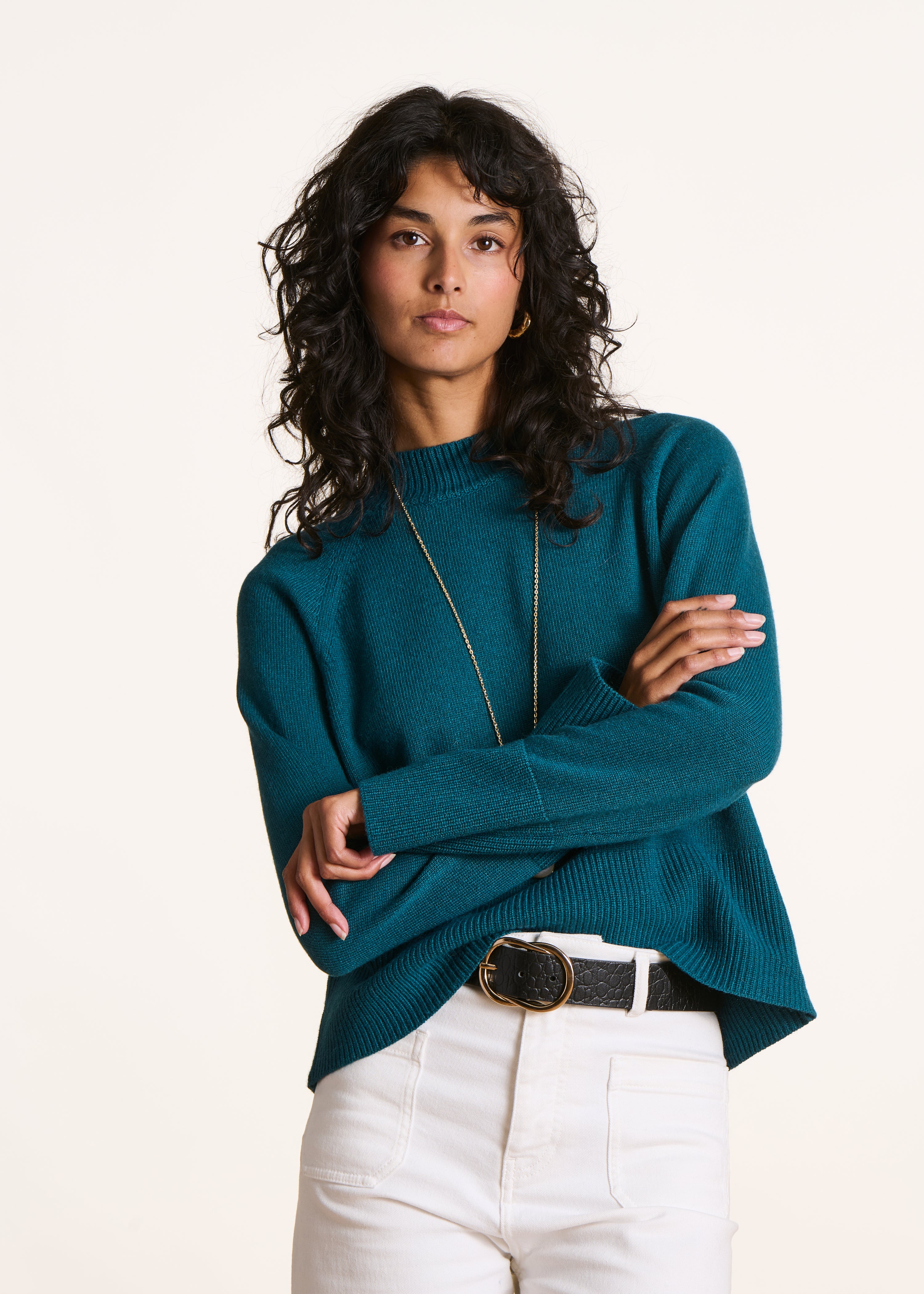 Loose petrol blue sweater with high collar
