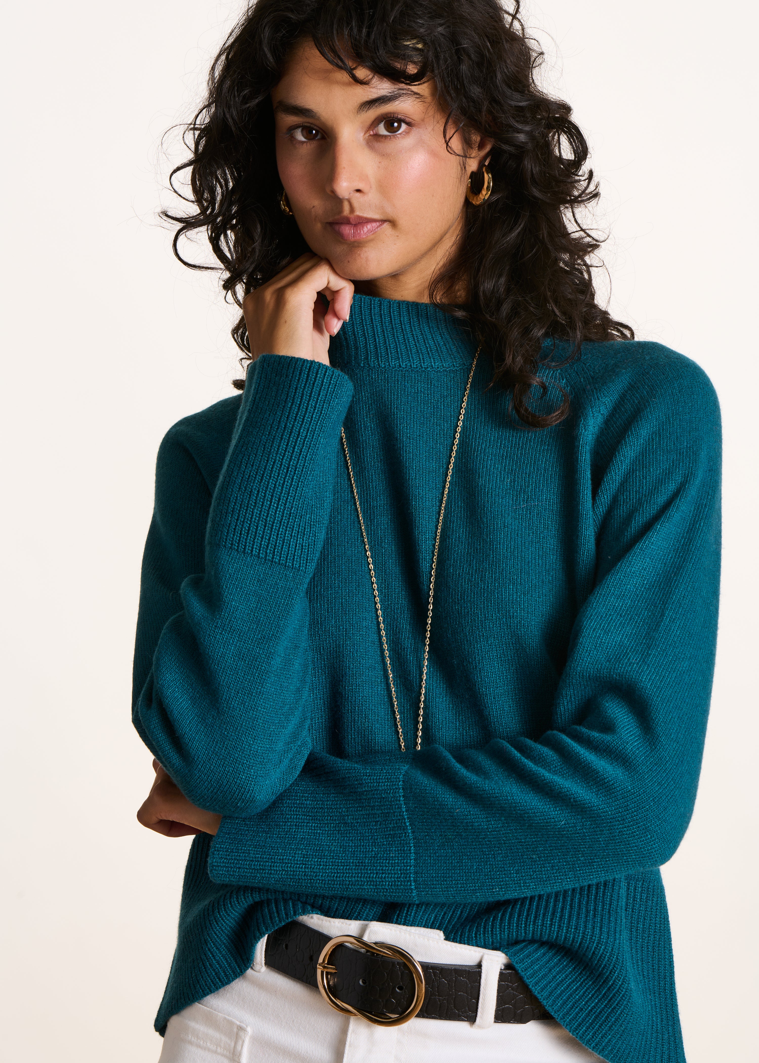 Loose petrol blue sweater with high collar