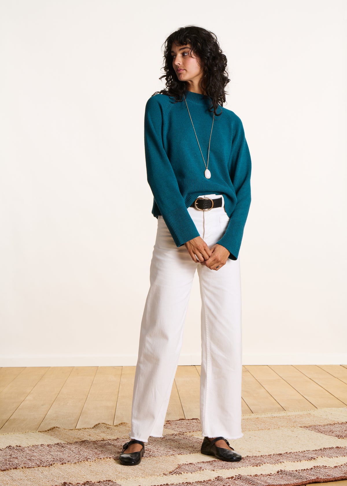 Loose petrol blue sweater with high collar