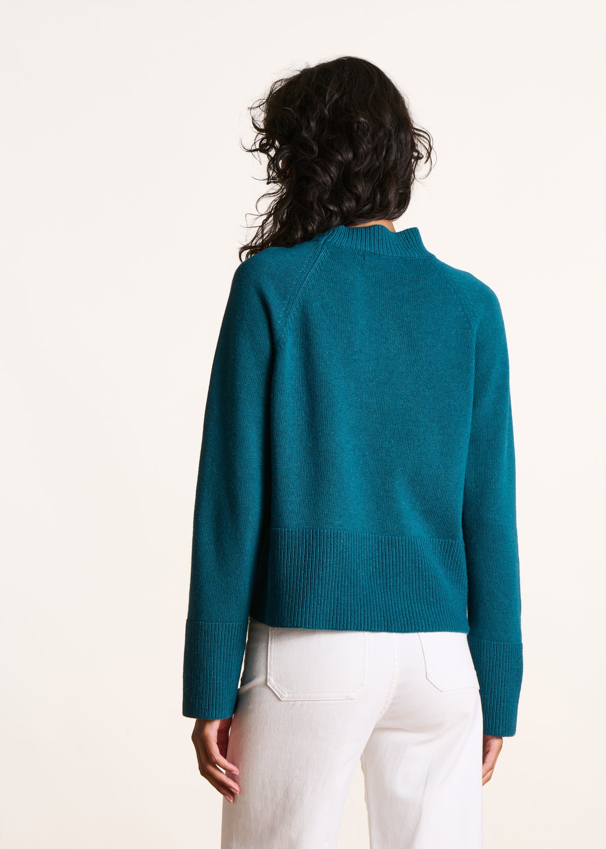 Loose petrol blue sweater with high collar