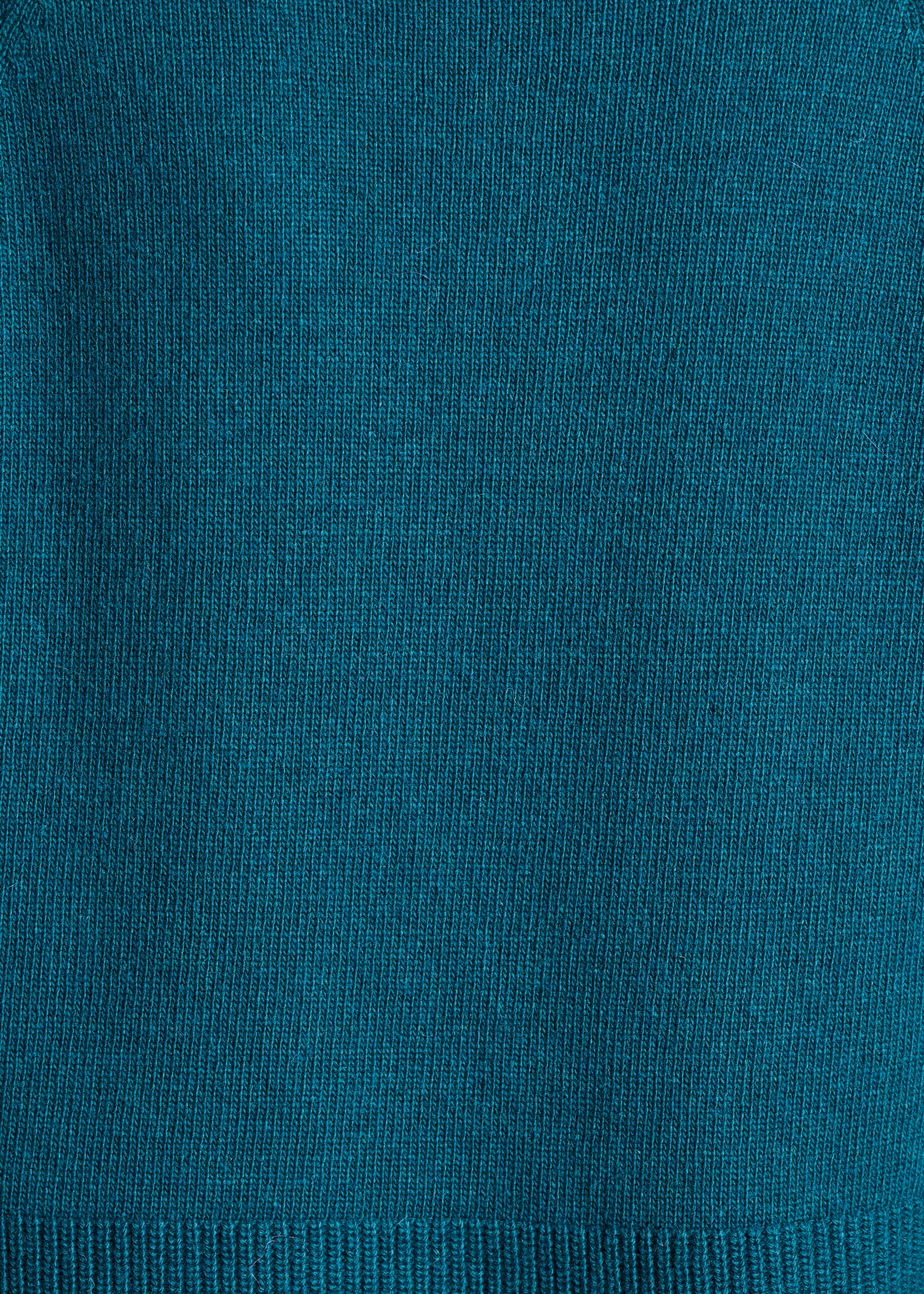 Loose petrol blue sweater with high collar