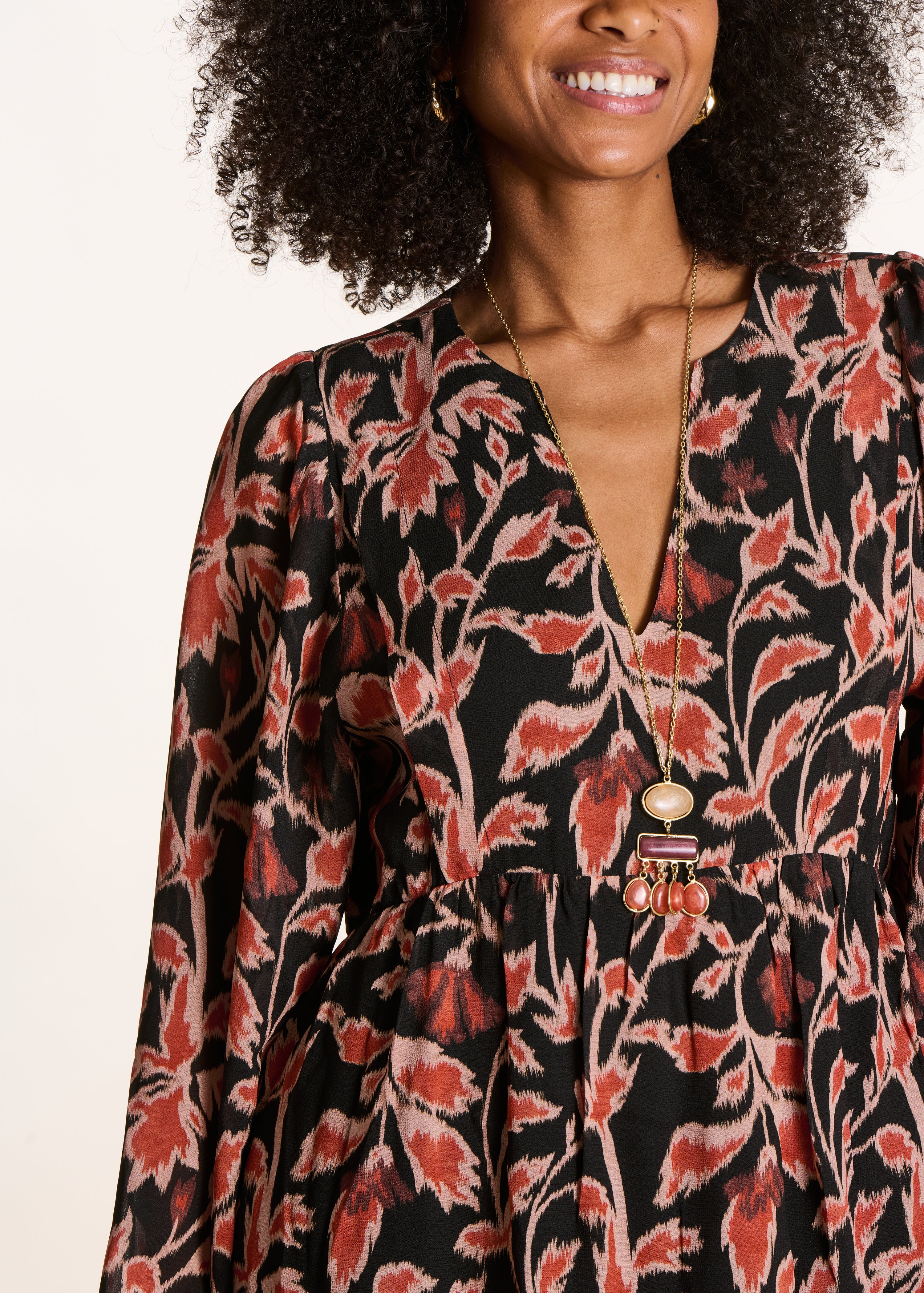 Short black flared V-neck dress with print