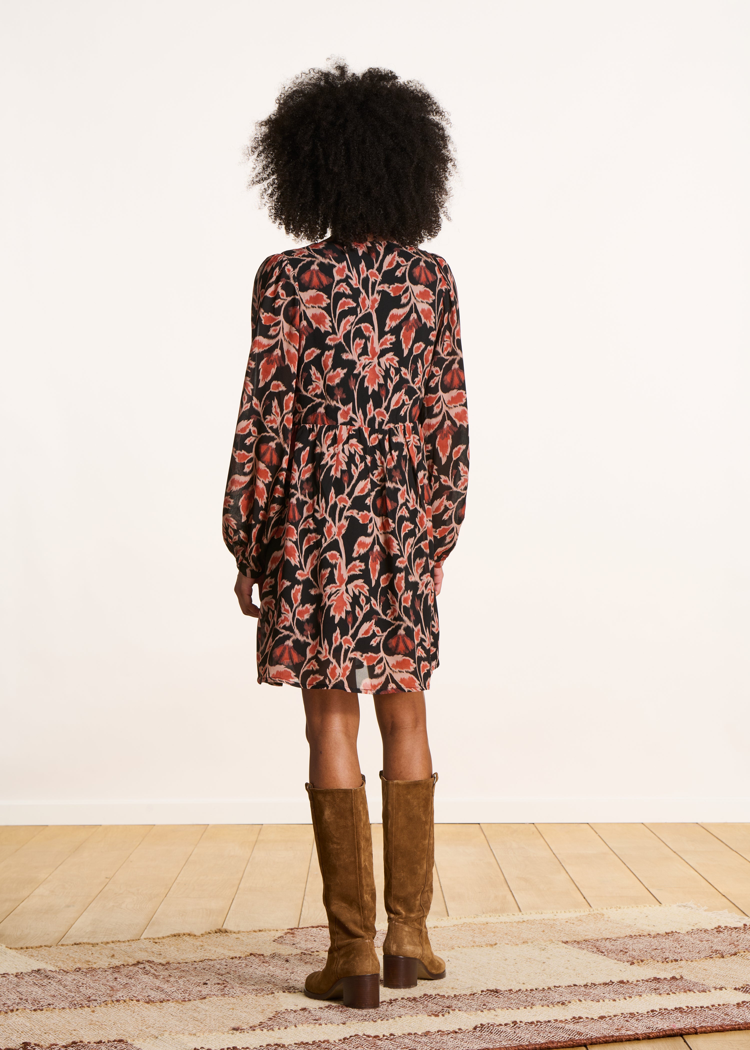 Short black flared V-neck dress with print