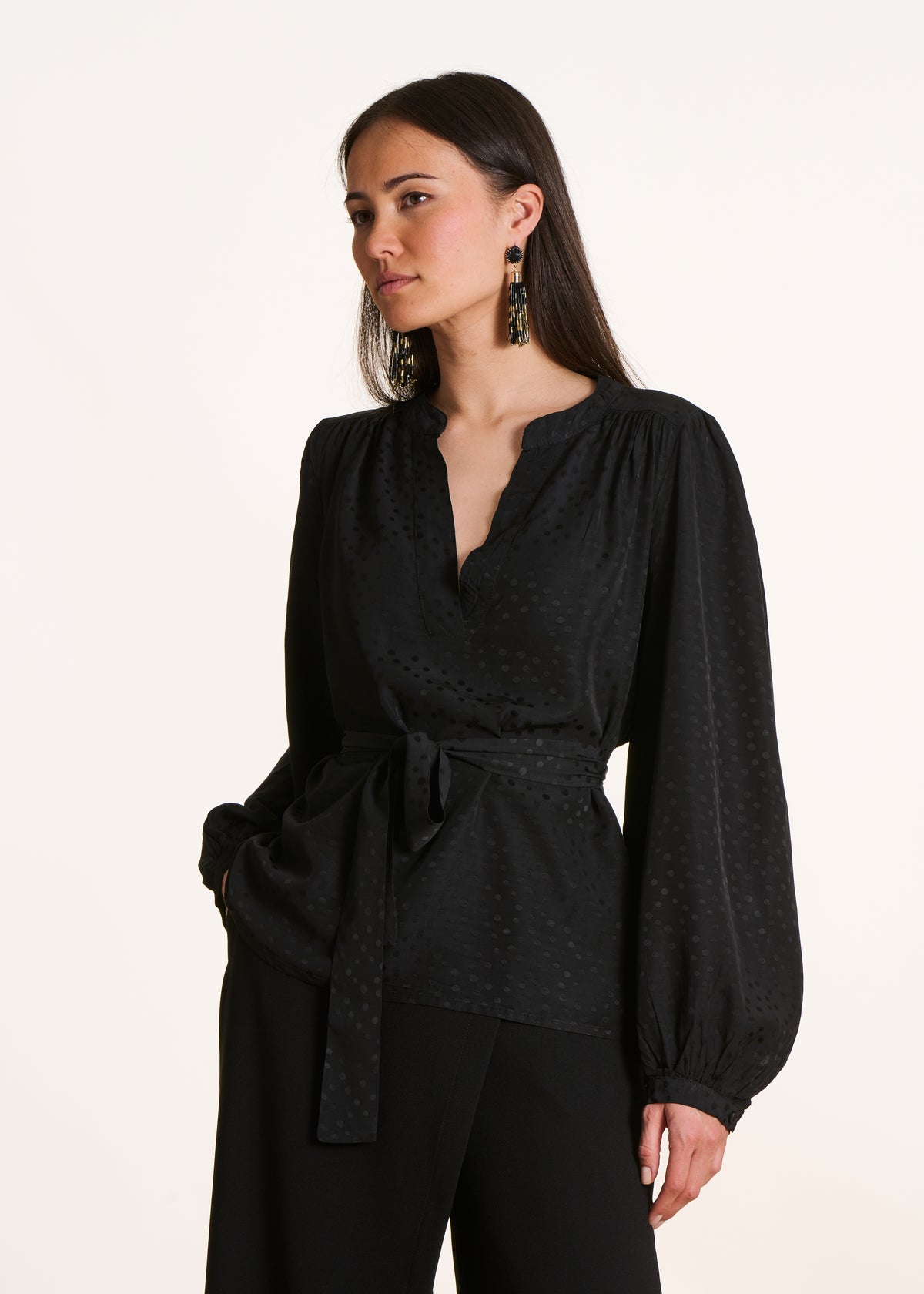Long-sleeved black belted top