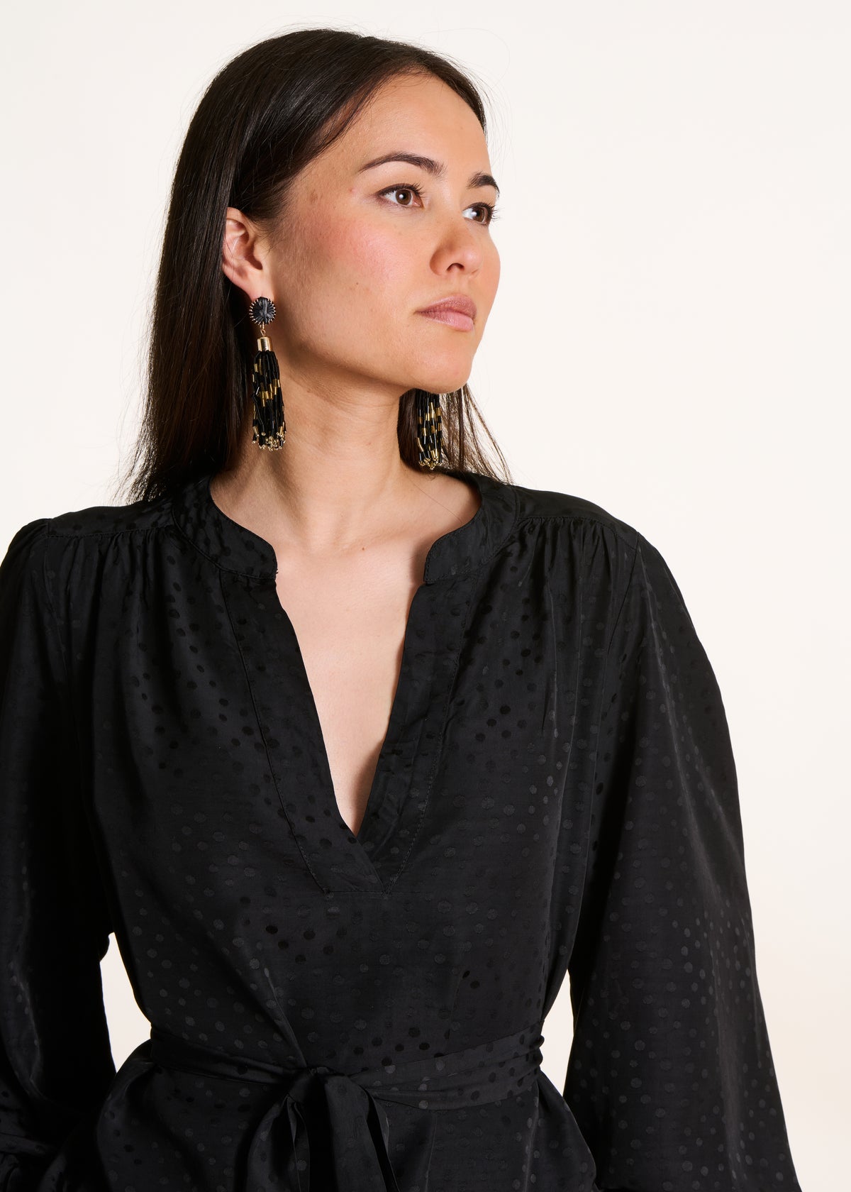 Long-sleeved black belted top