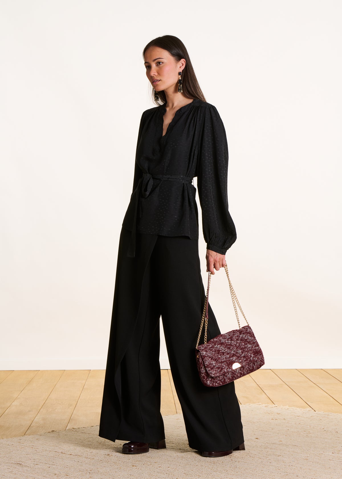 Long-sleeved black belted top