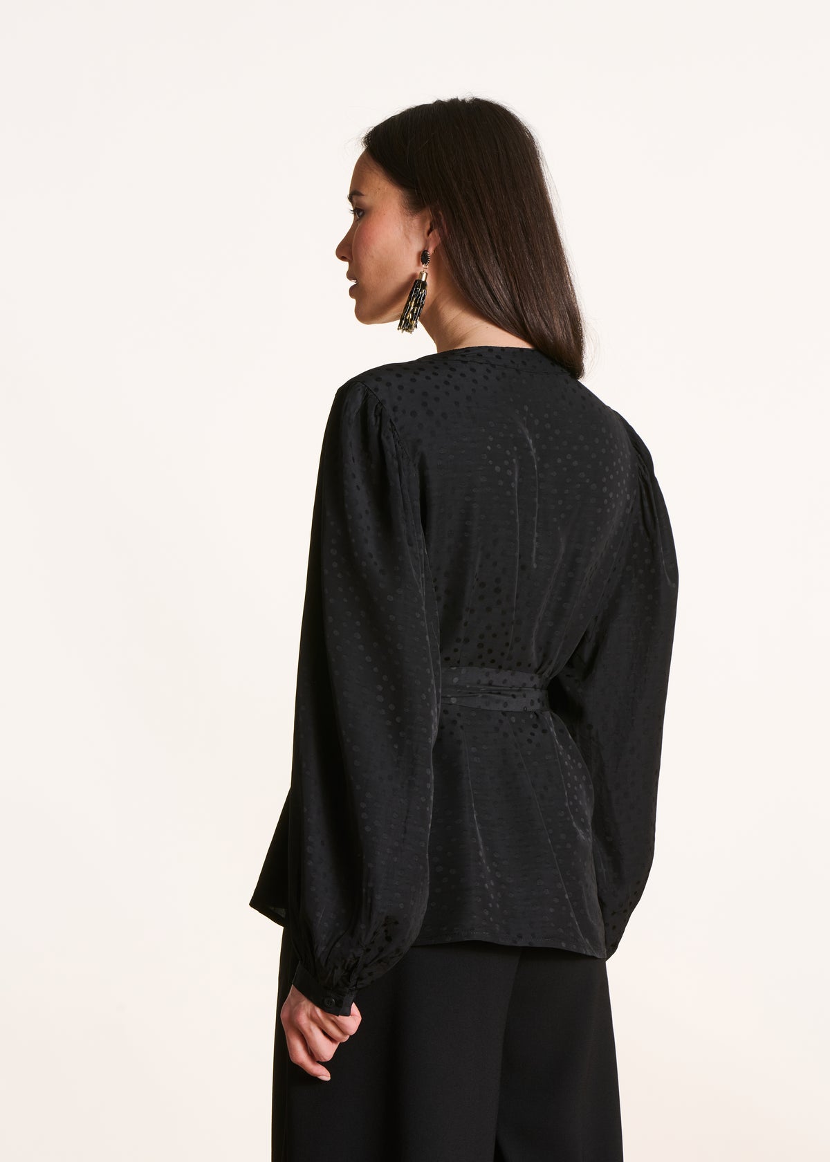 Long-sleeved black belted top