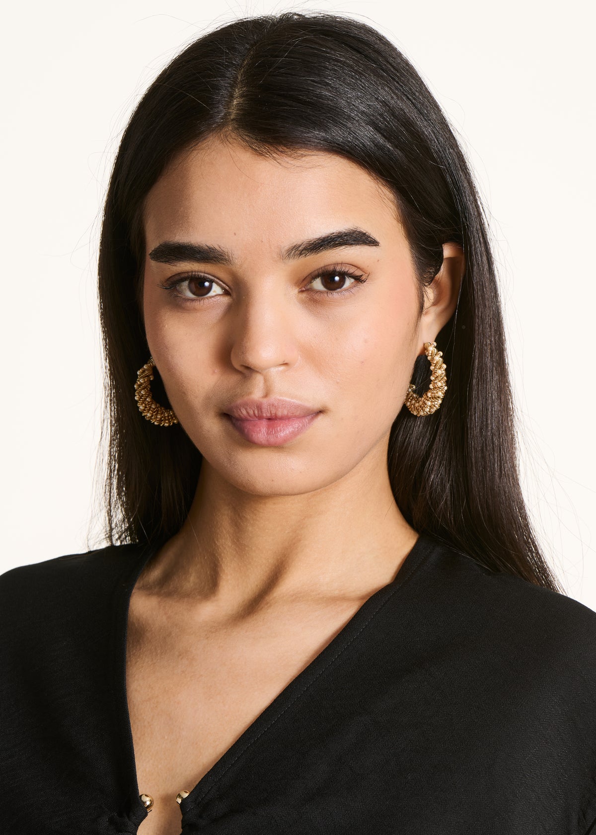 Golden hoop earrings with pearls
