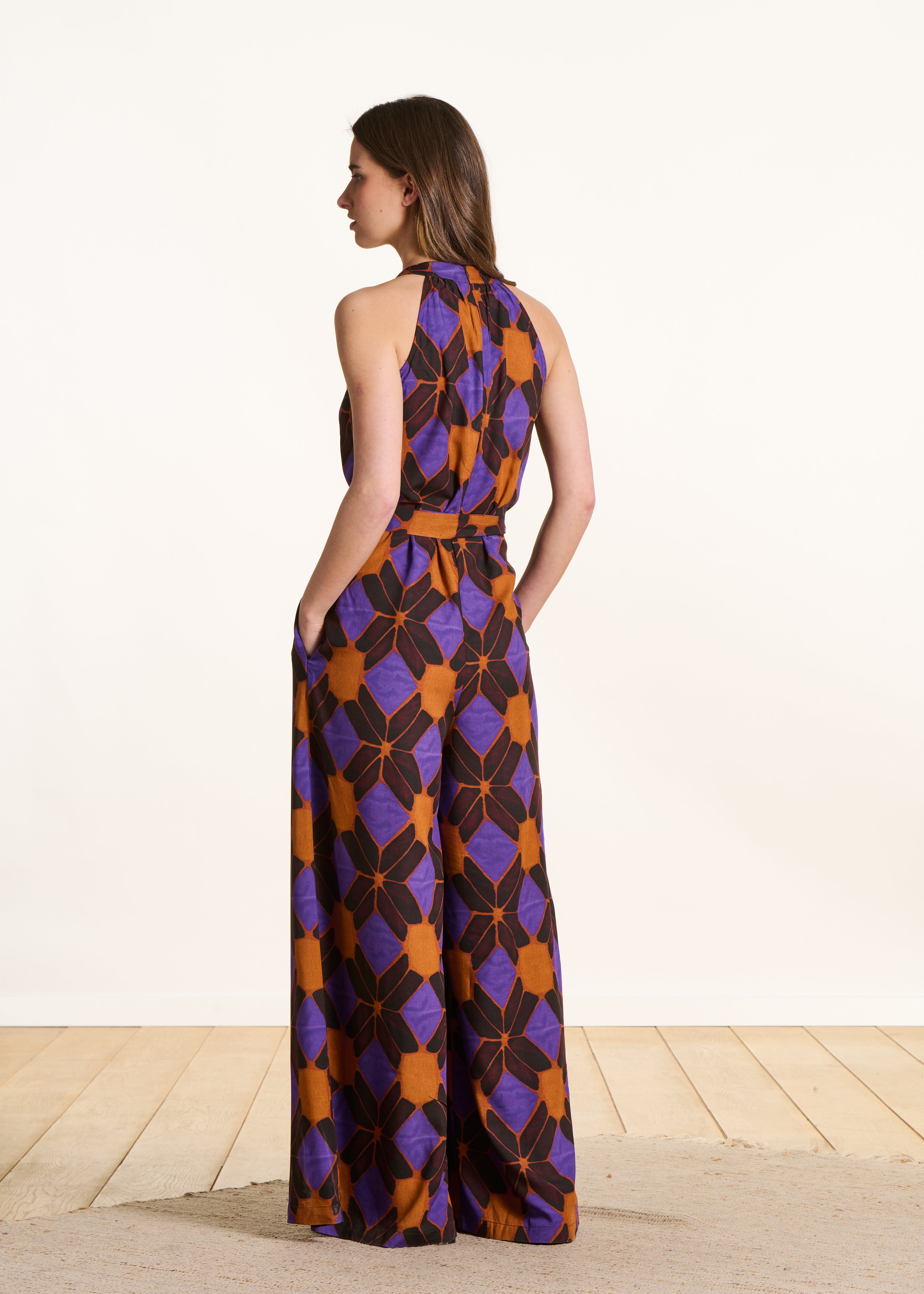 Sleeveless jumpsuit with orange and purple print