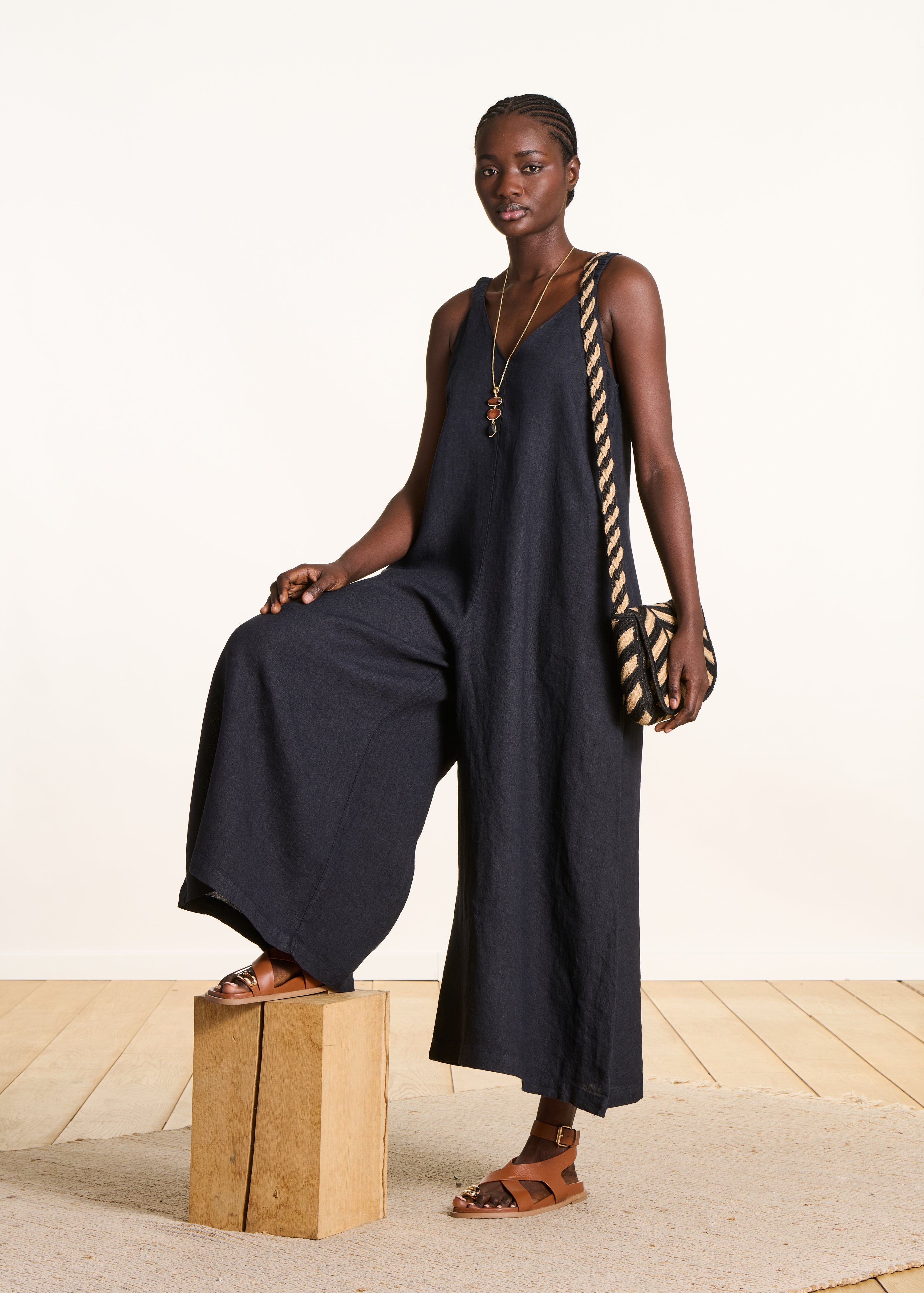 Dark blue linen jumpsuit with elastic straps