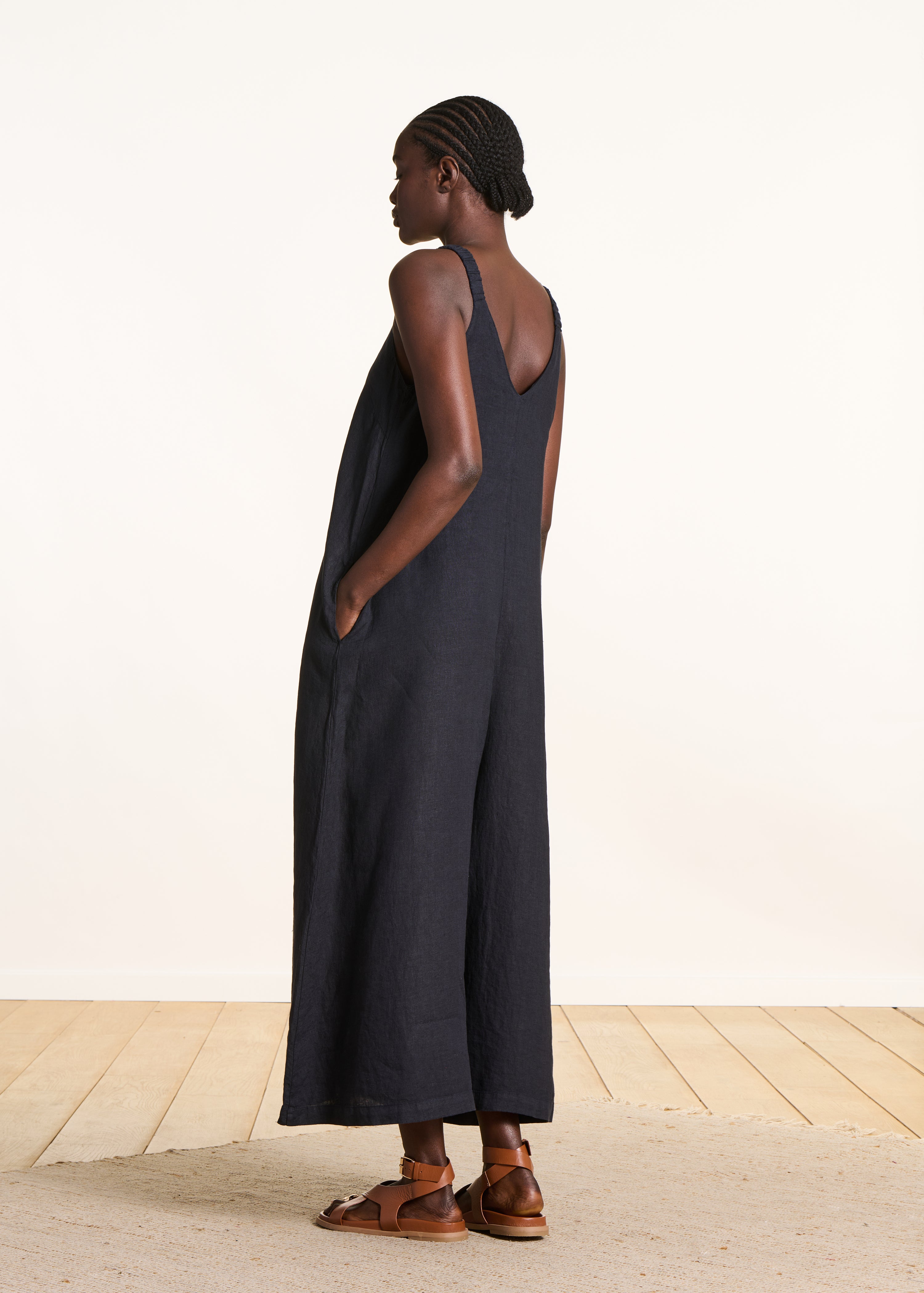 Dark blue linen jumpsuit with elastic straps