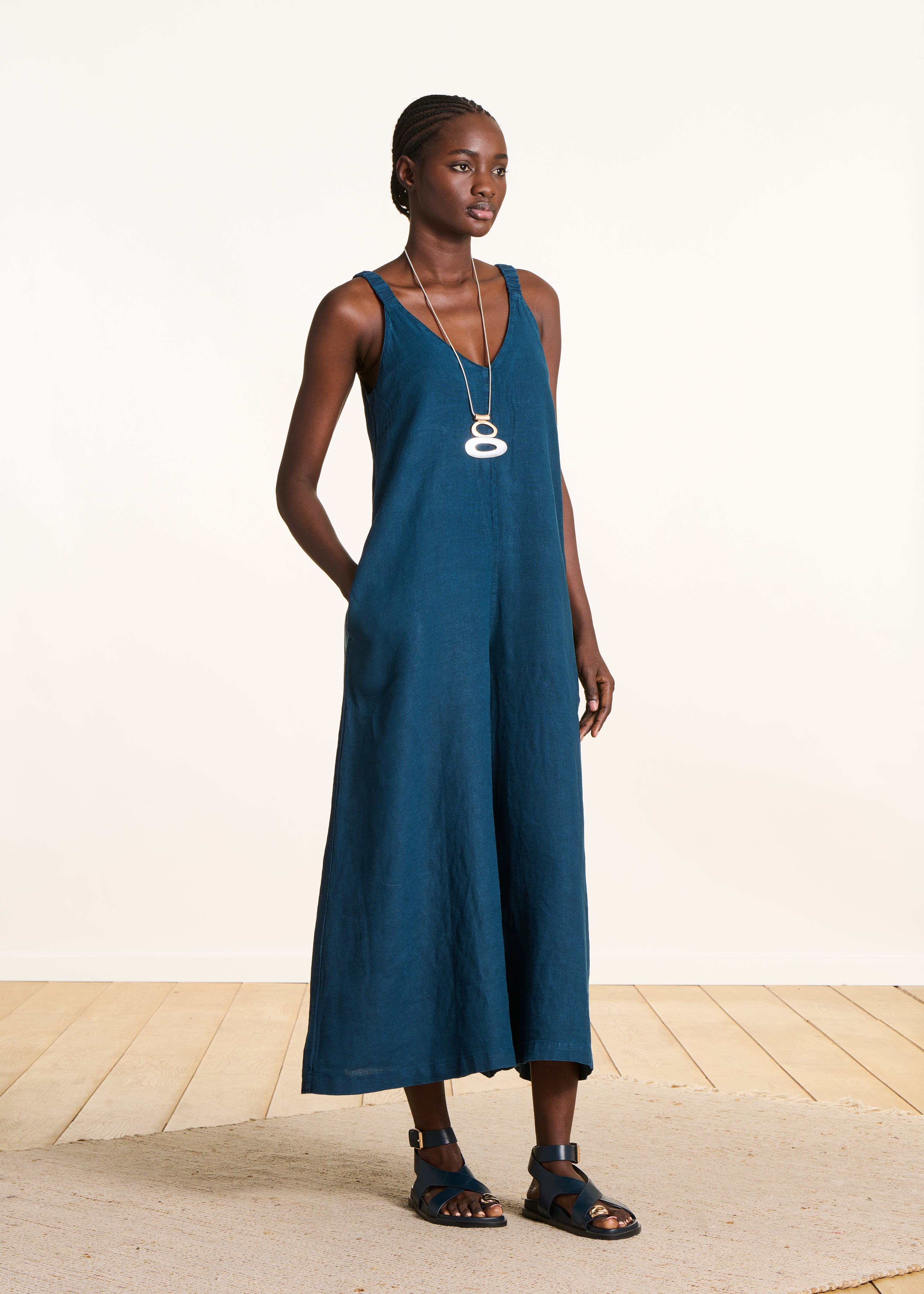 Petrol blue linen jumpsuit with elastic straps