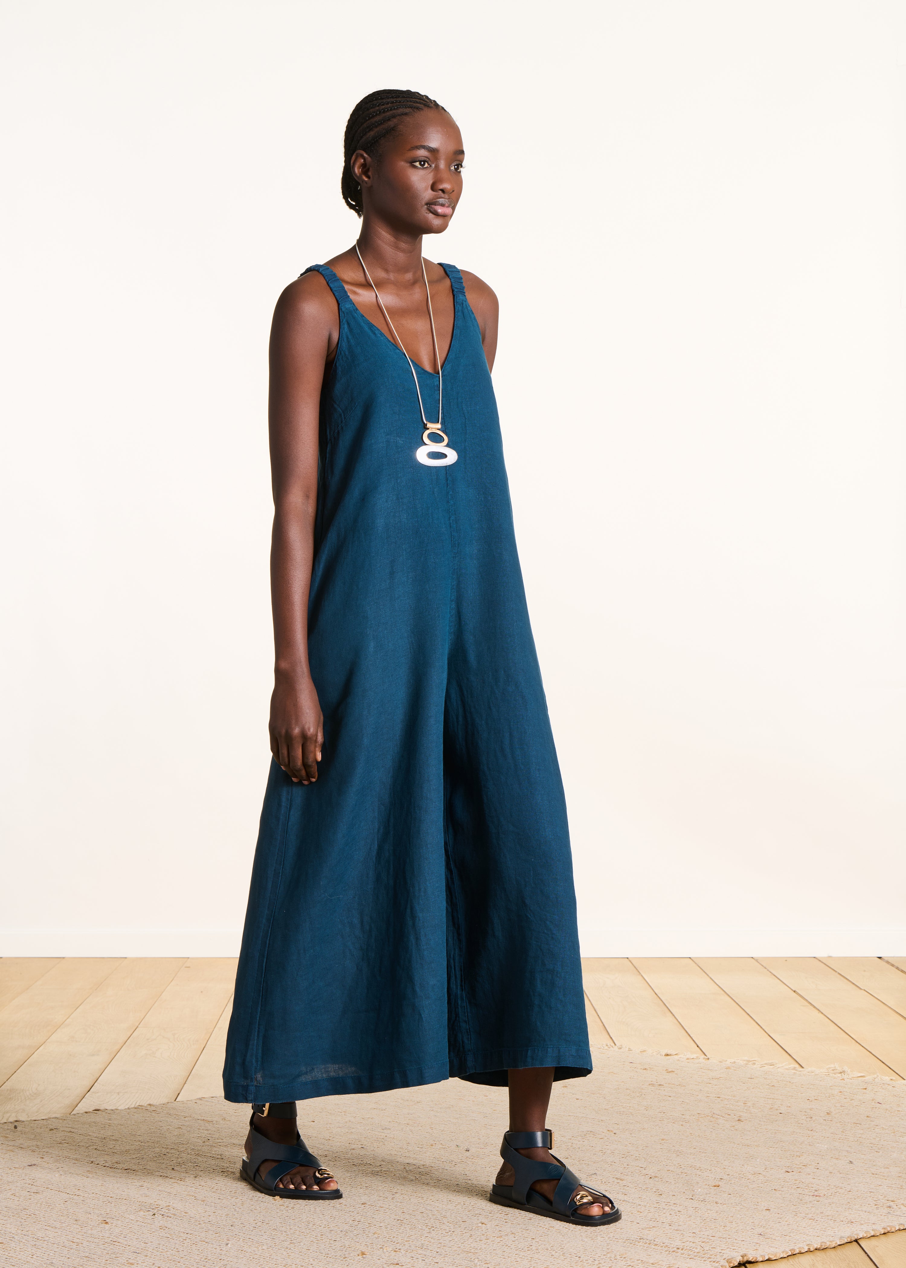 Petrol blue linen jumpsuit with elastic straps
