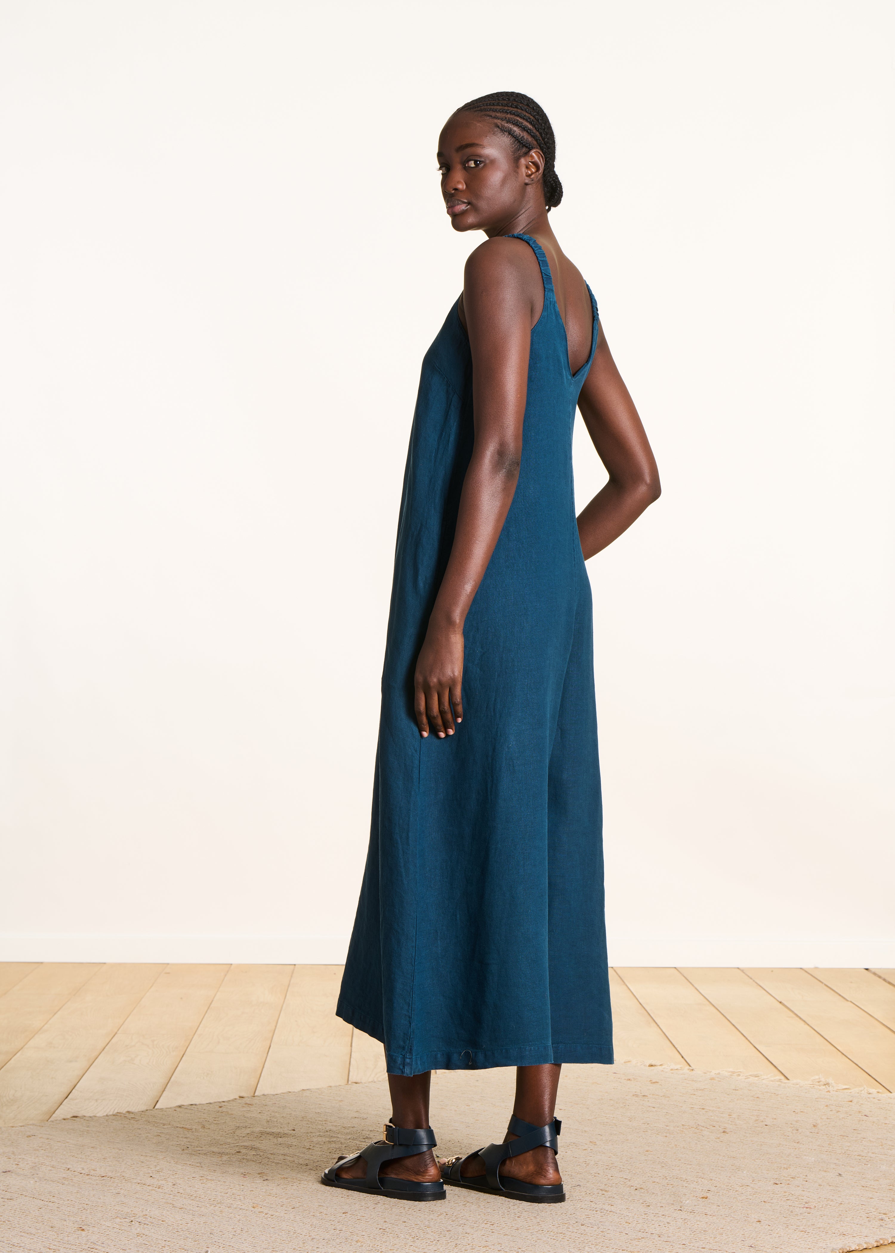 Petrol blue linen jumpsuit with elastic straps