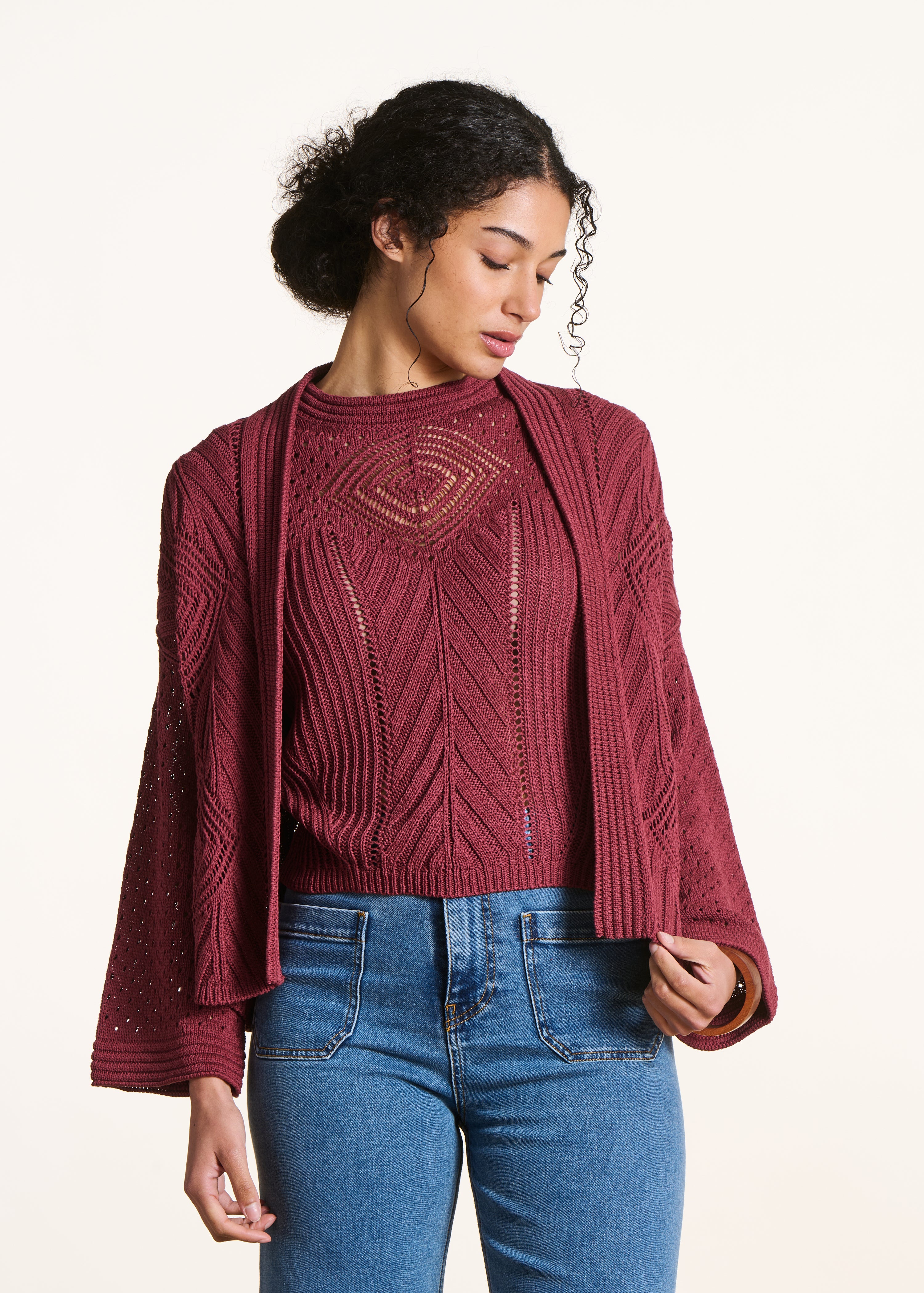 Open burgundy vest in openwork crochet knit