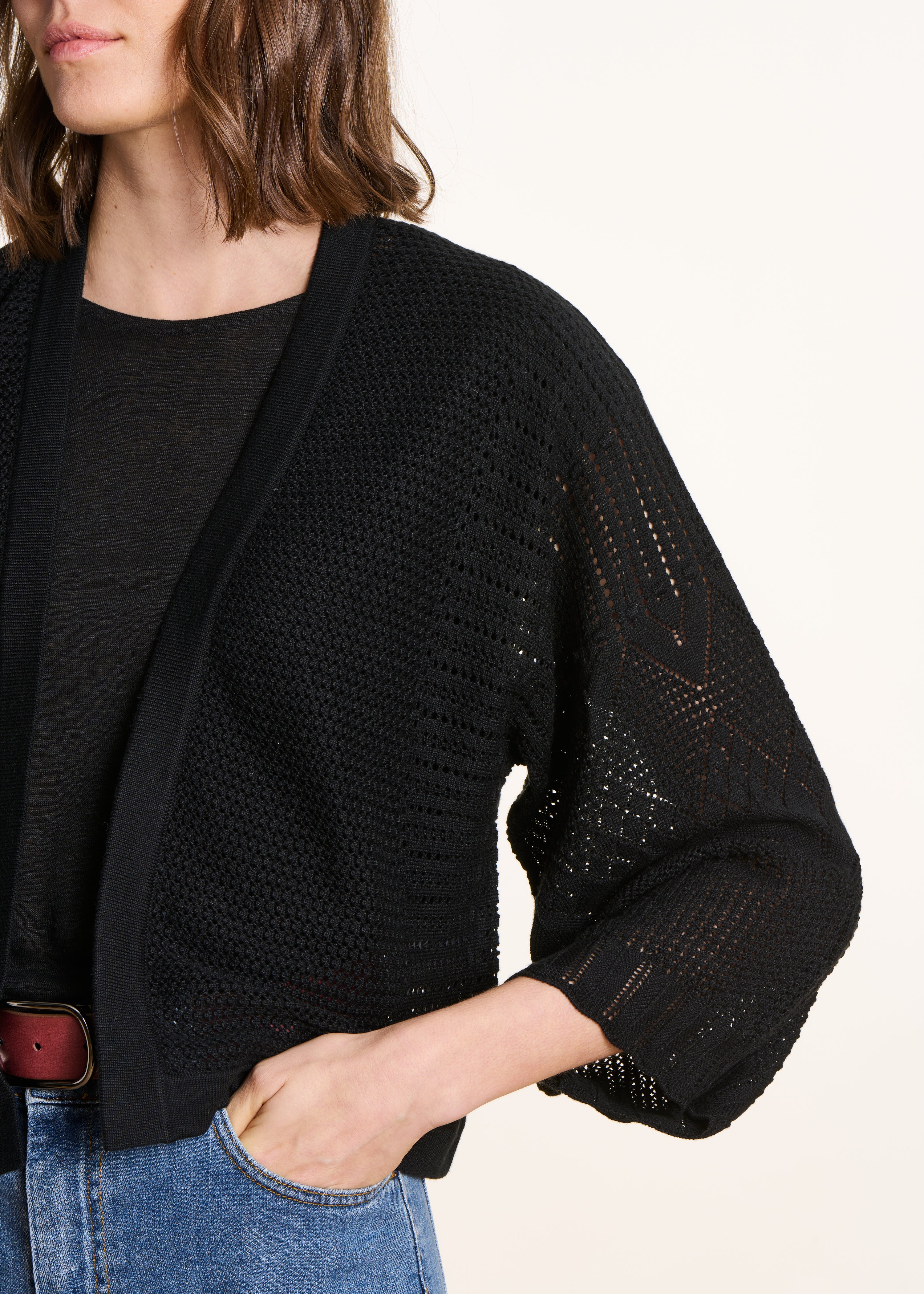 Short black cardigan in pointelle knit