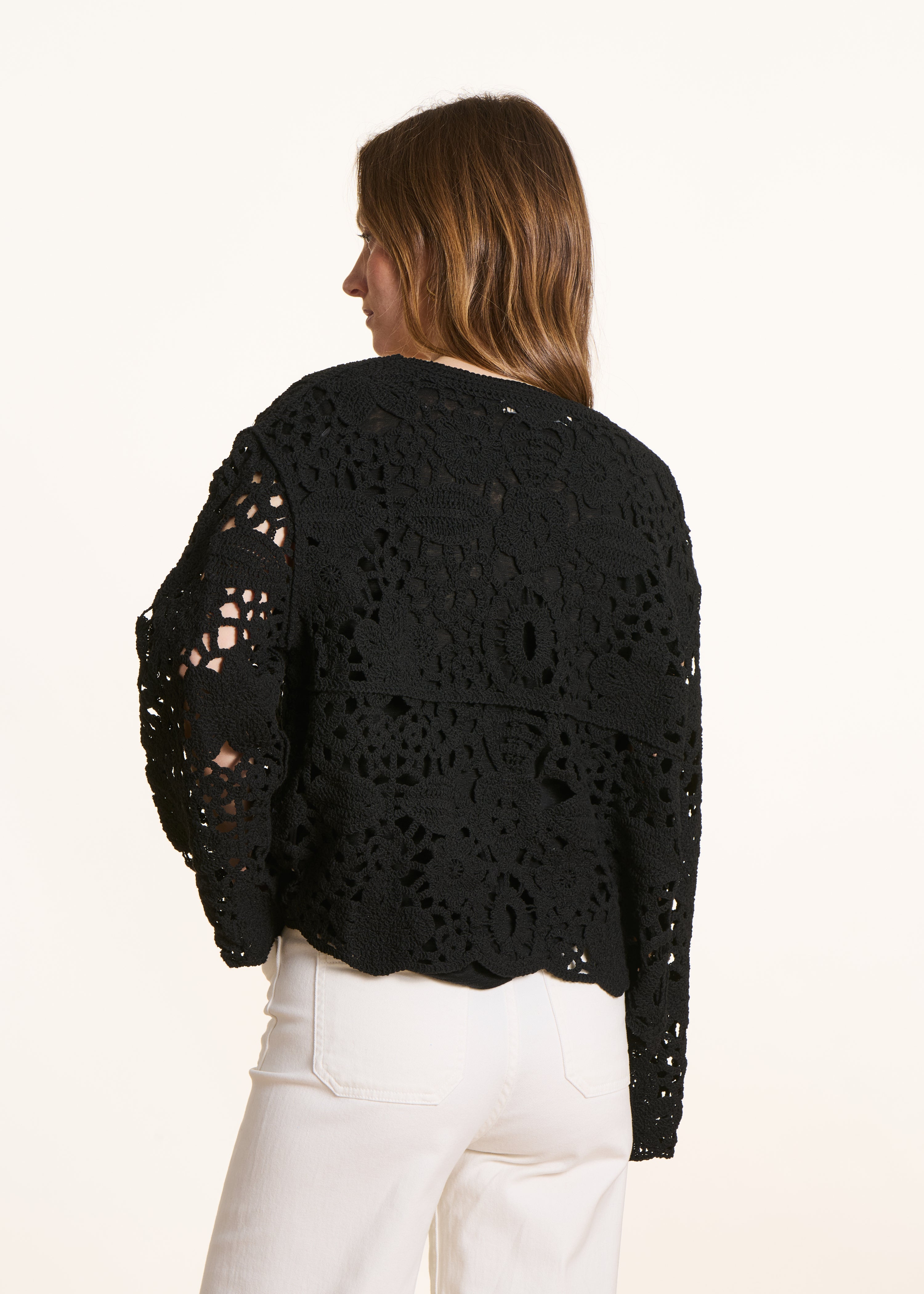 Open short cardigan in black crochet knit