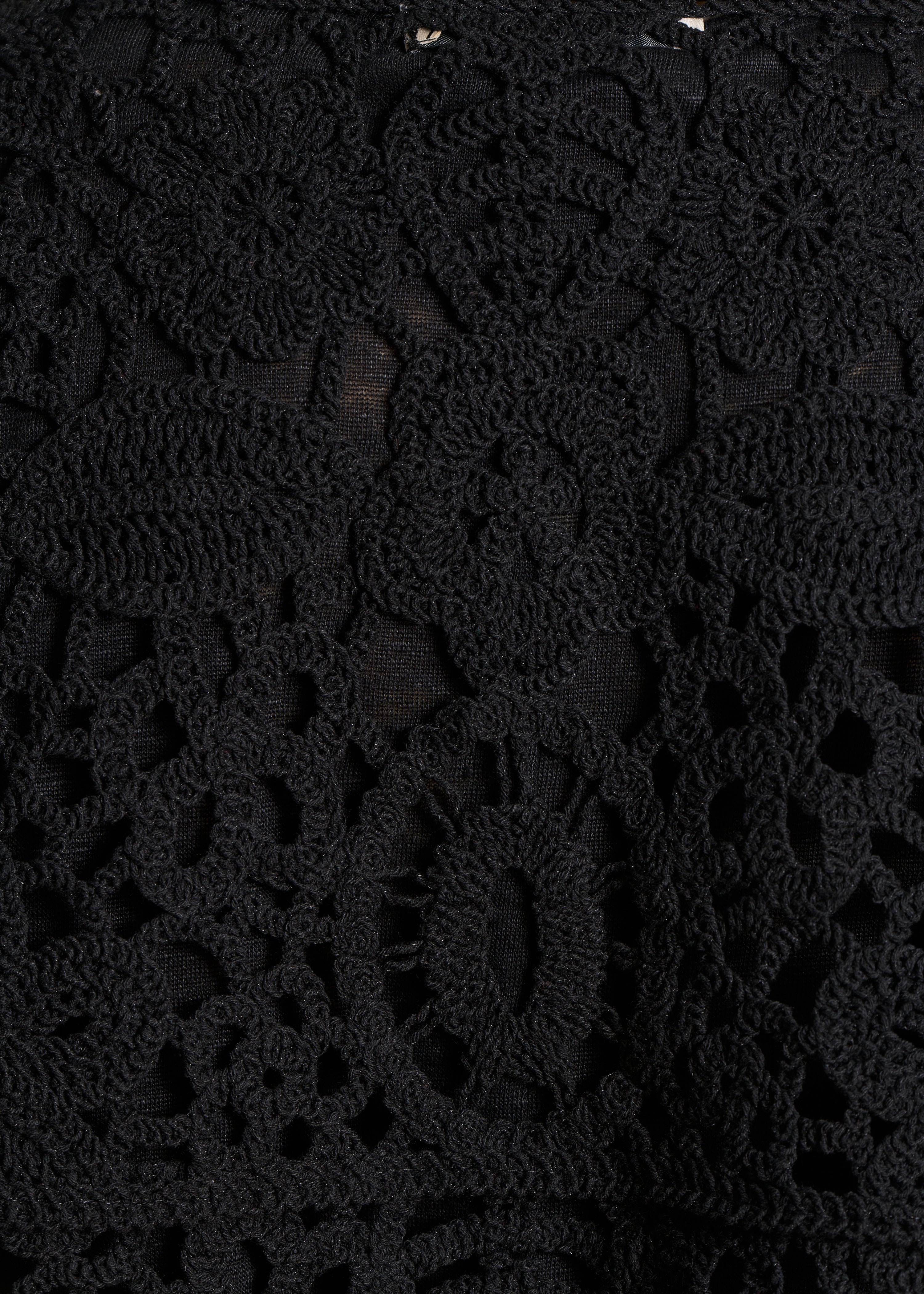 Open short cardigan in black crochet knit