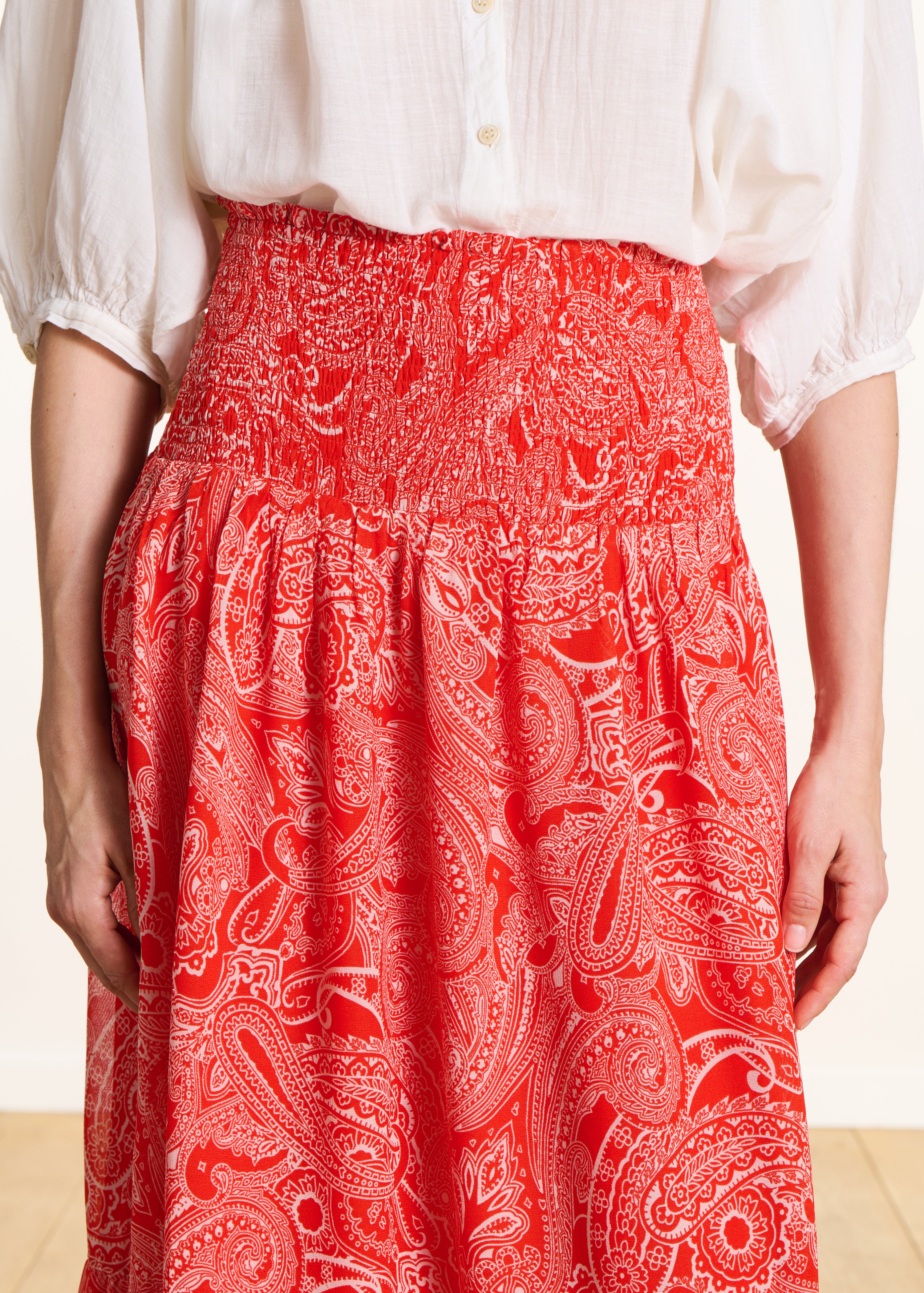 Long orange voile skirt with print and smocking