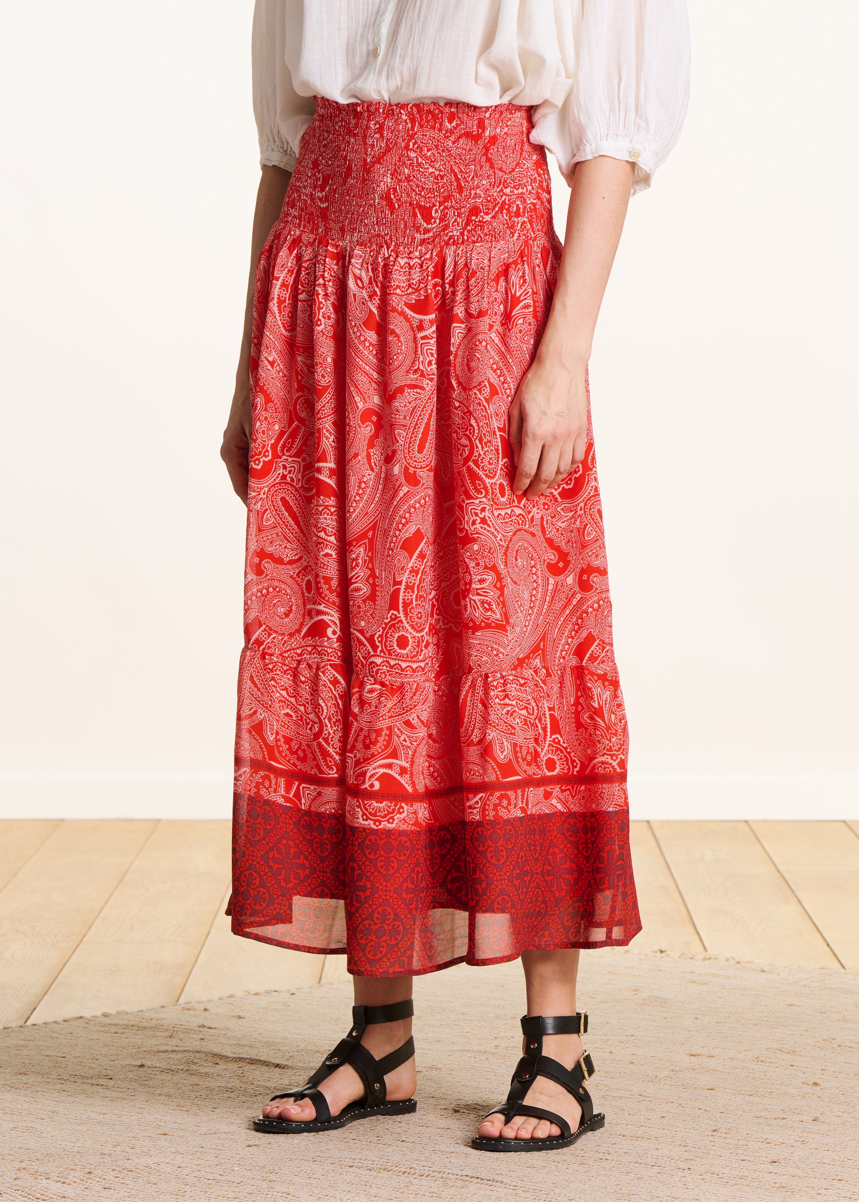 Long orange voile skirt with print and smocking