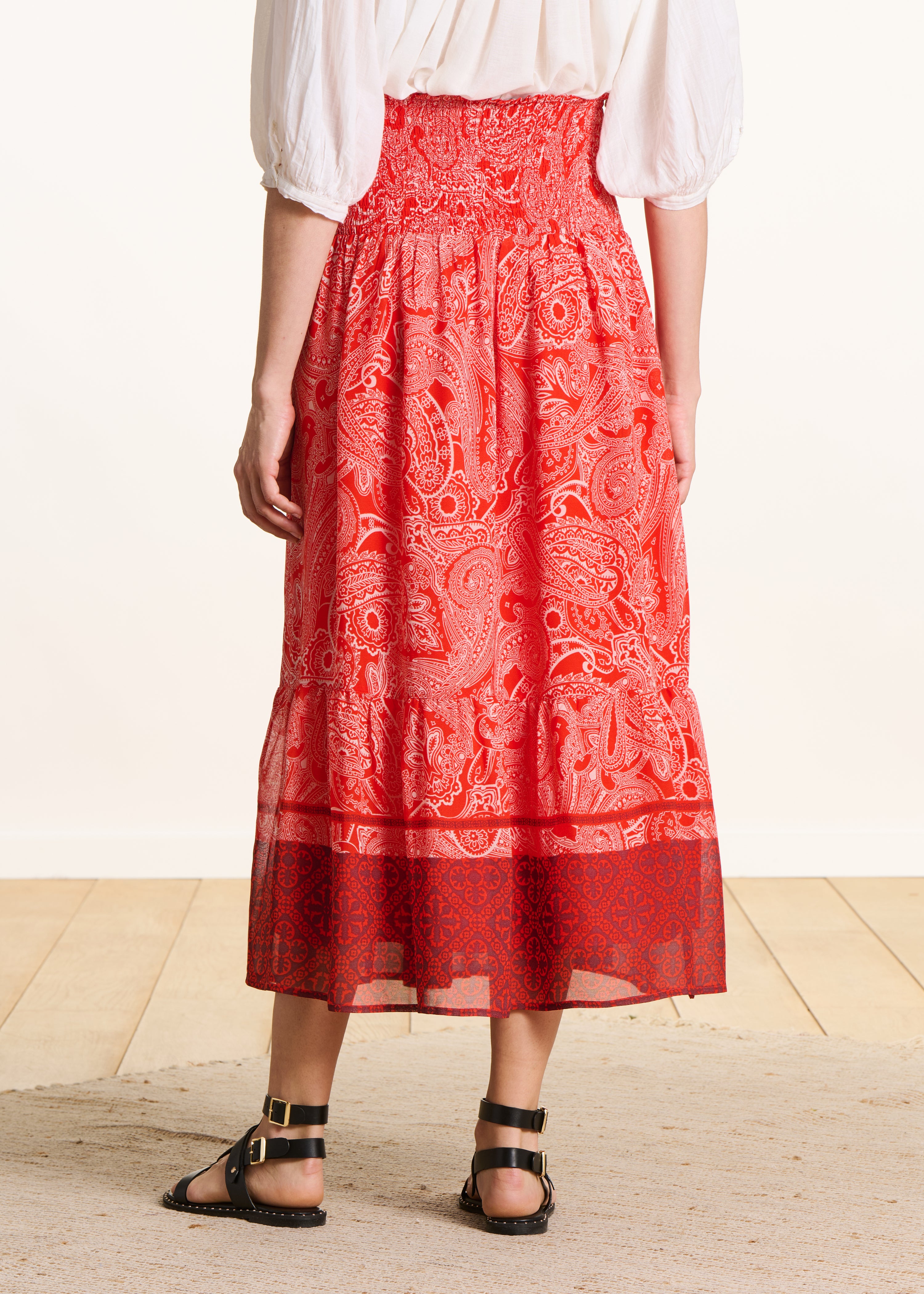 Long orange voile skirt with print and smocking
