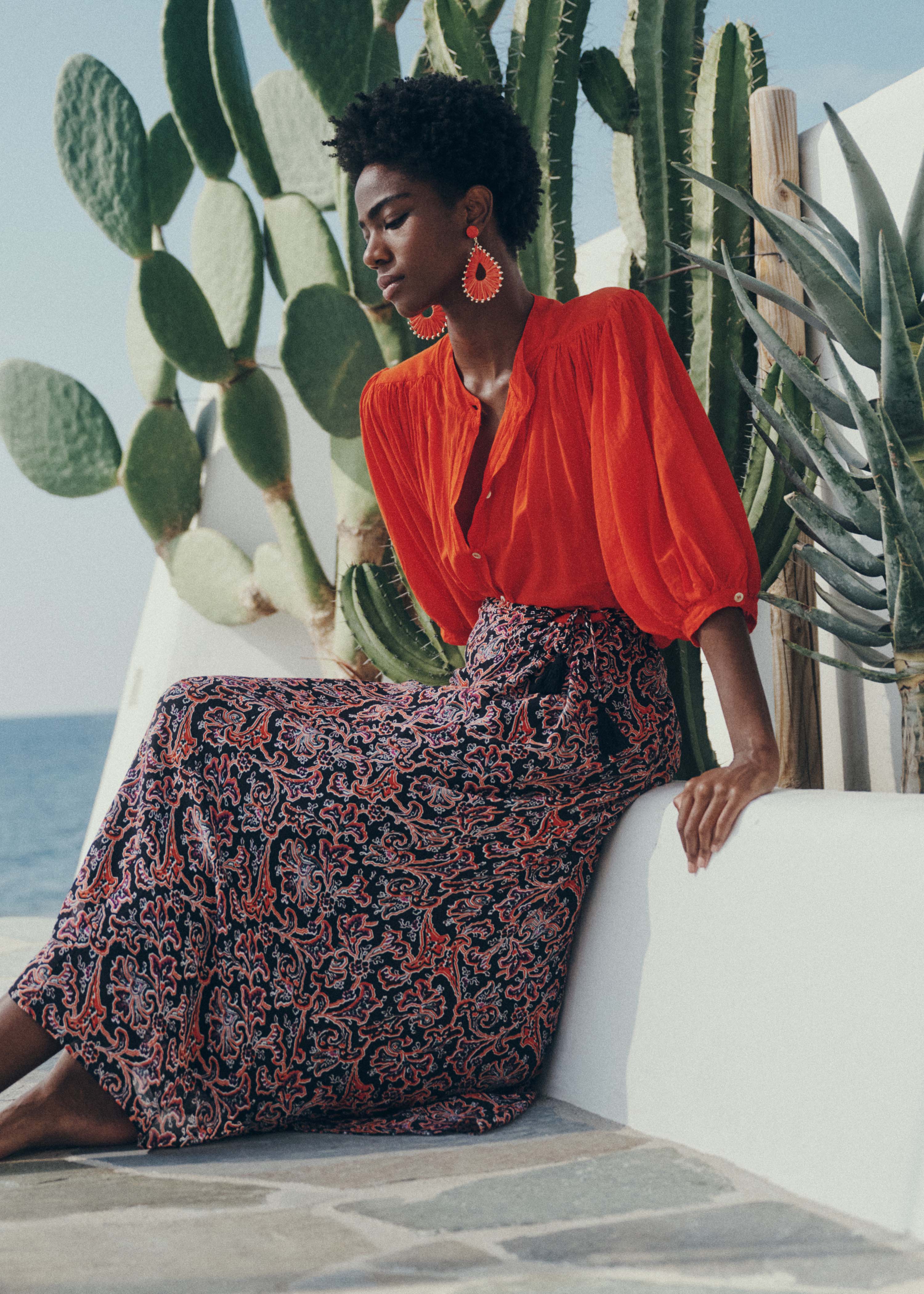 Black flared long skirt with floral print