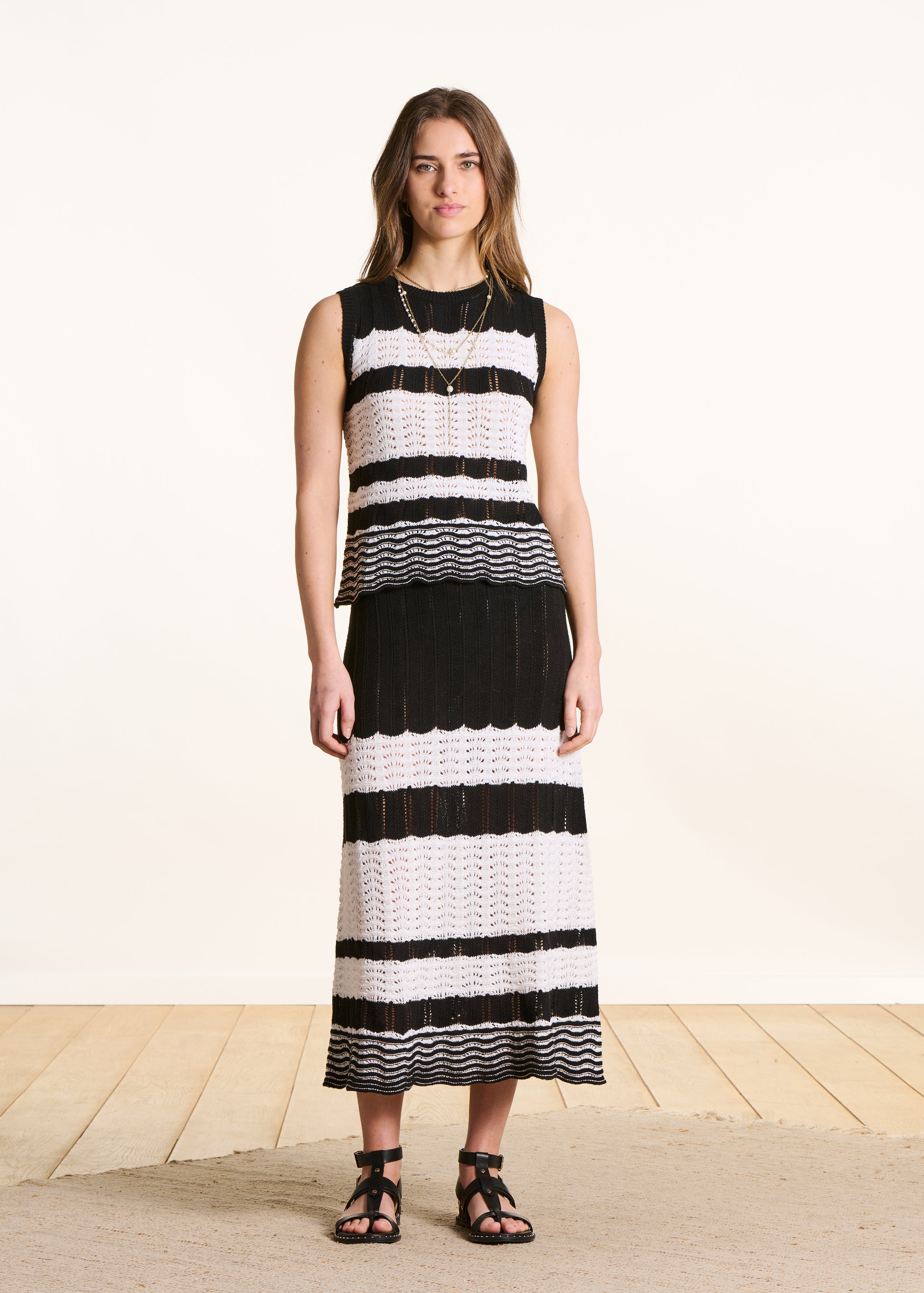 White and black openwork knit midi skirt