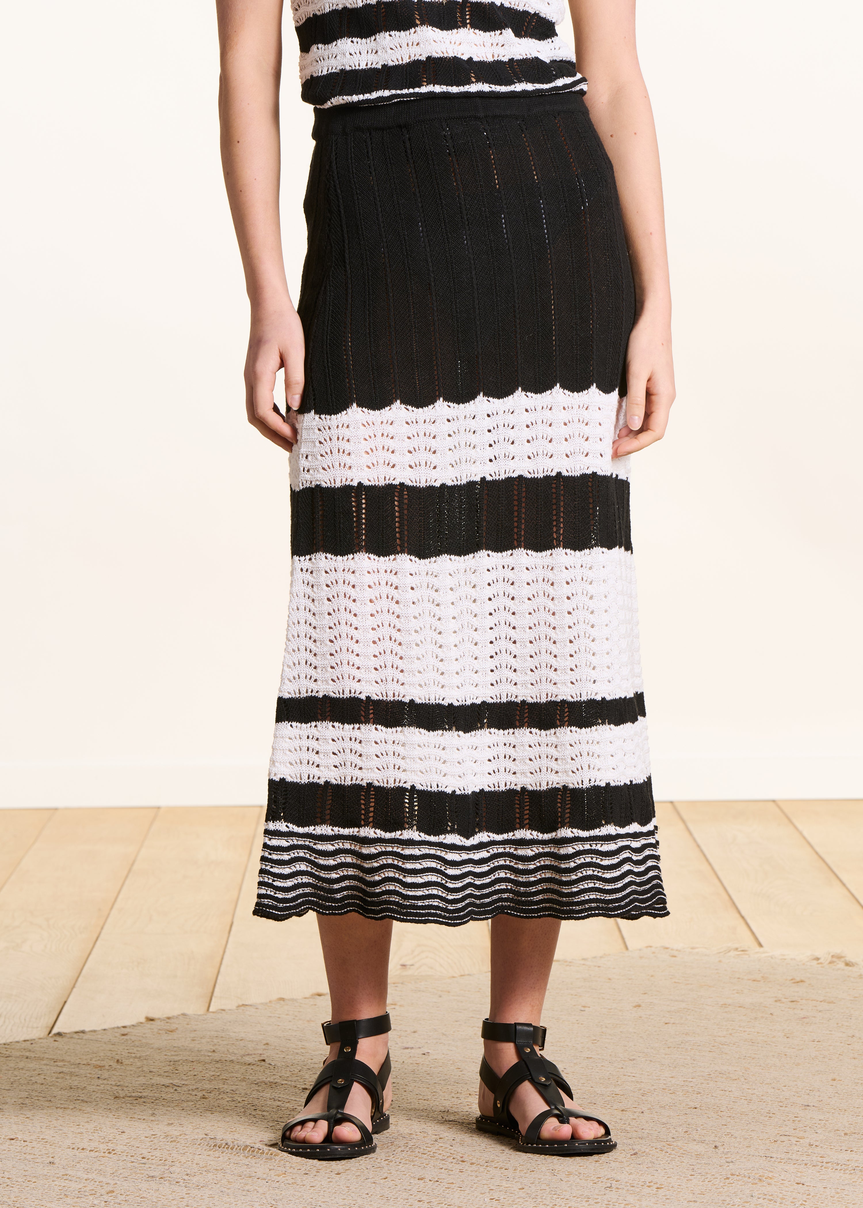 White and black openwork knit midi skirt