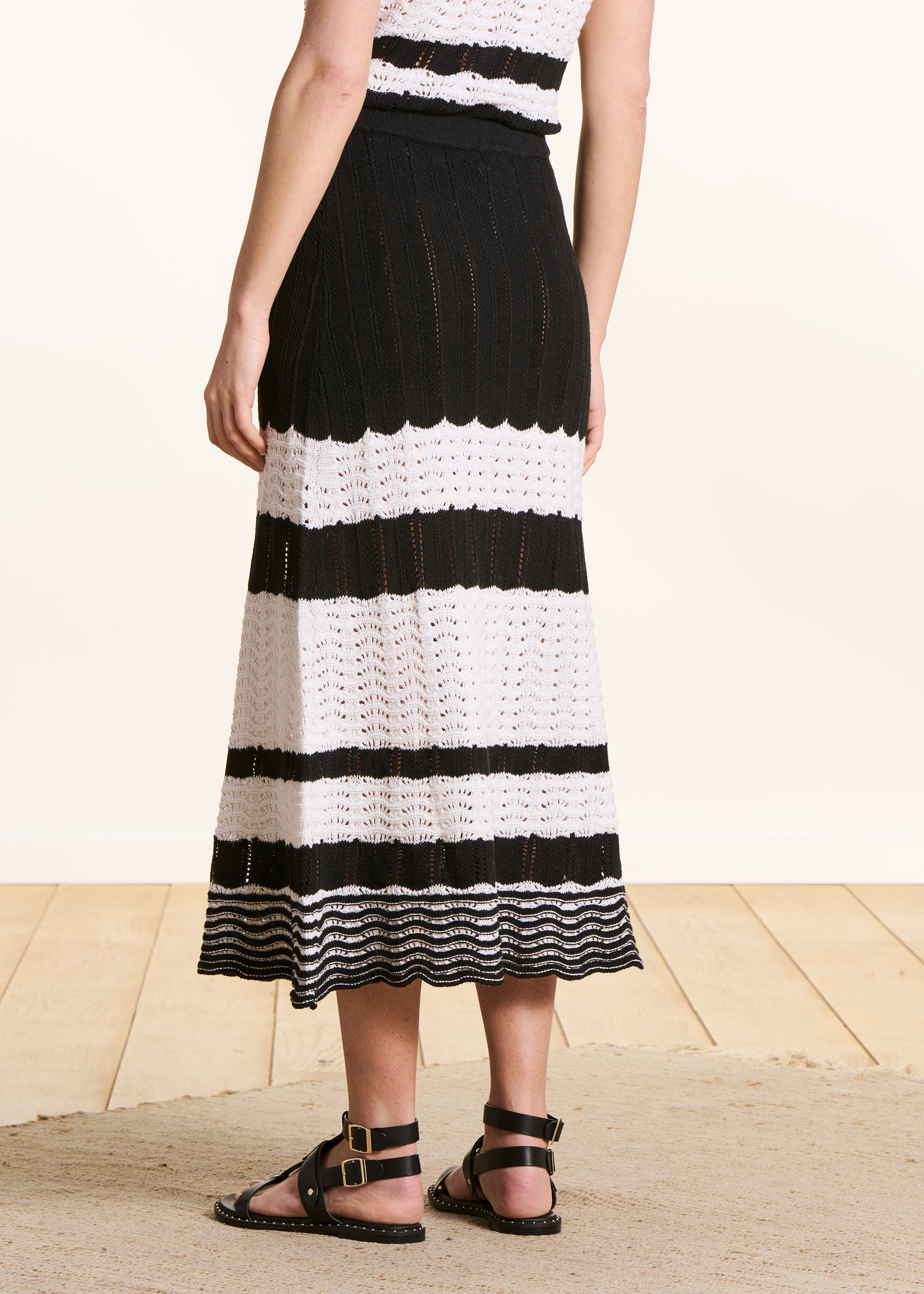 White and black openwork knit midi skirt