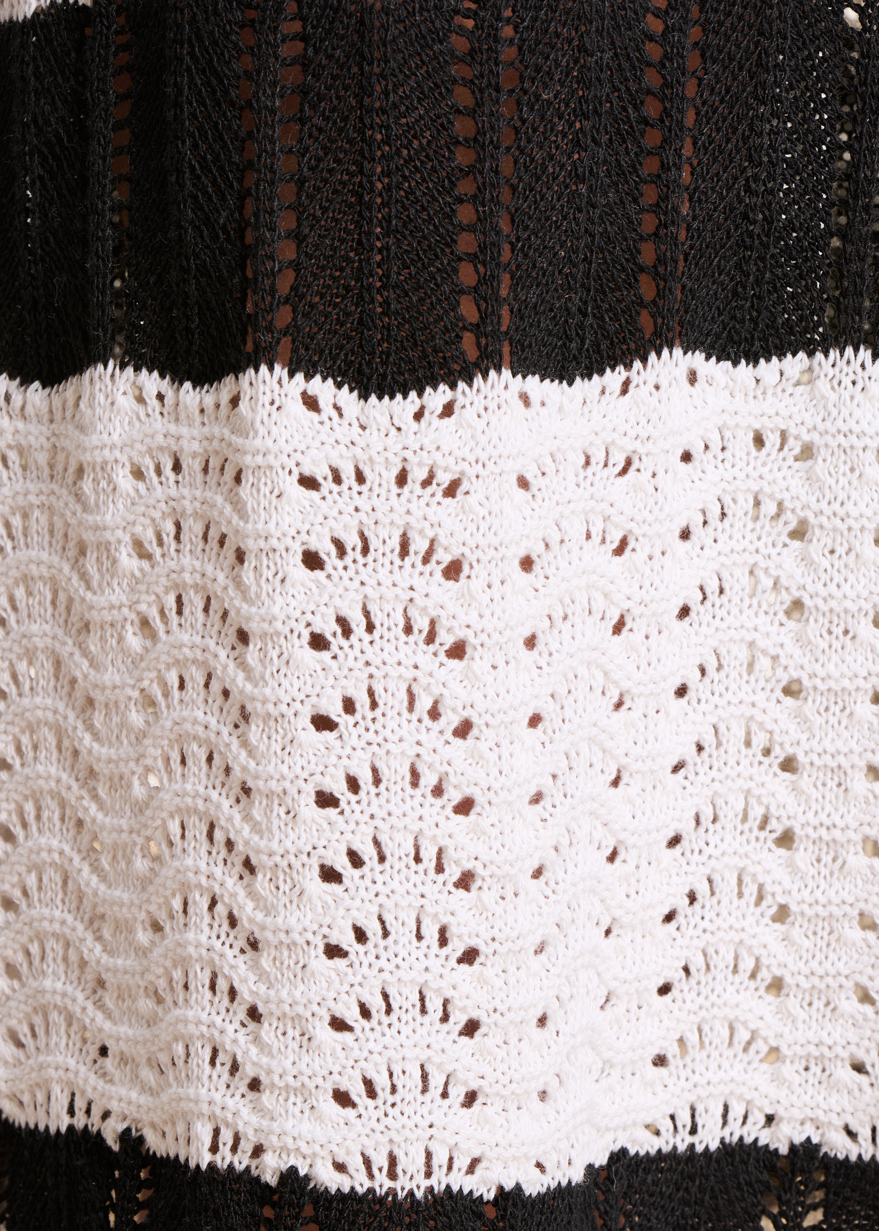 White and black openwork knit midi skirt