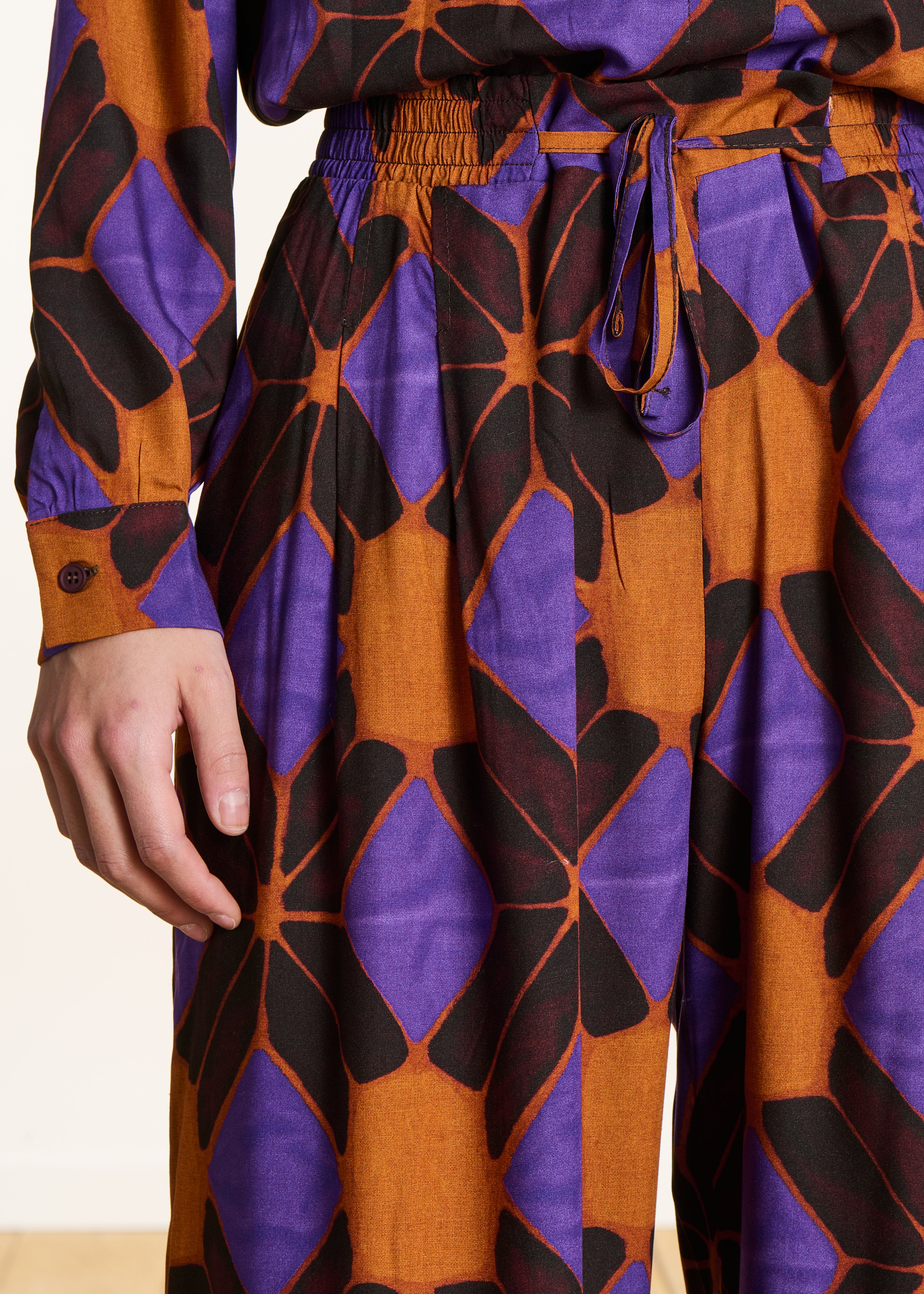 Wide orange and purple trousers with print