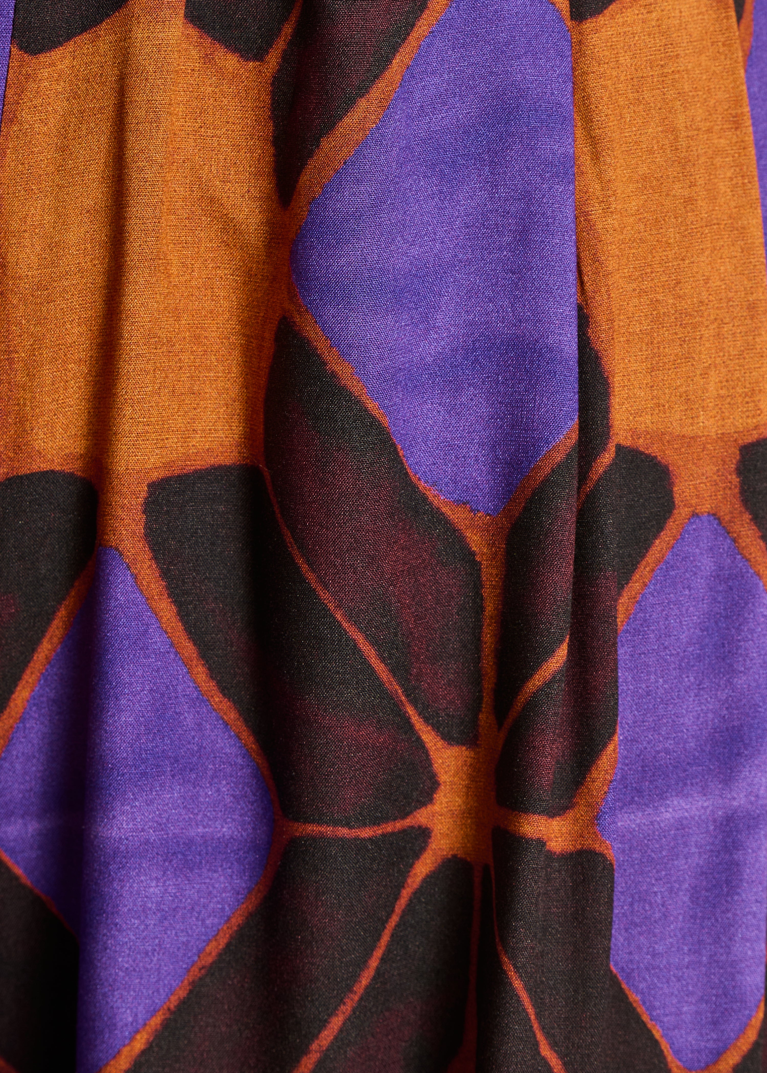 Wide orange and purple trousers with print
