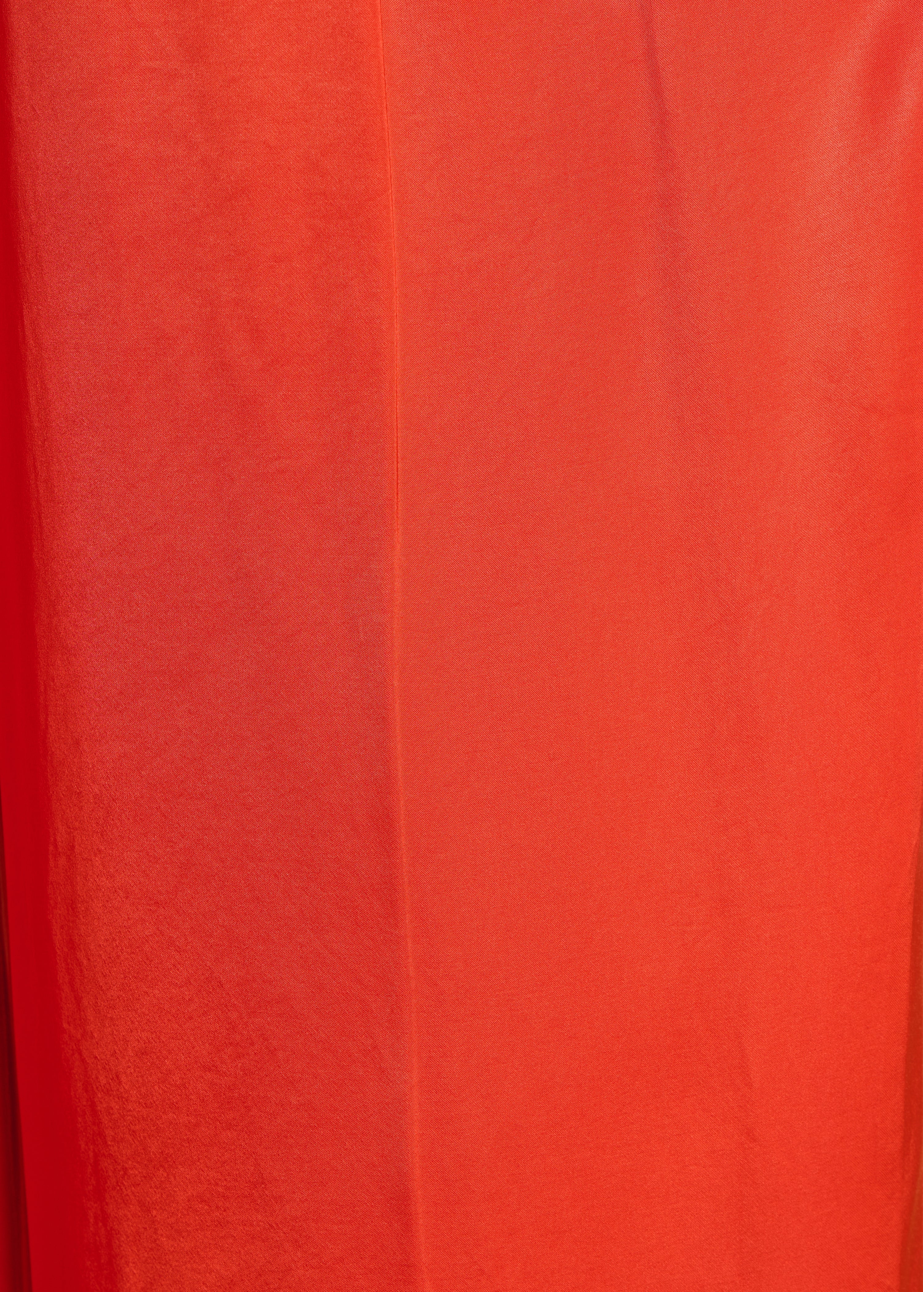 Wide high-waisted orange satin trousers